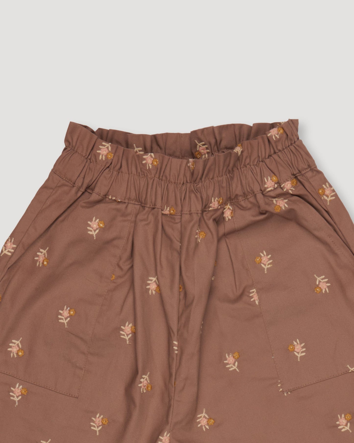 Early Sunday, Adrien Trouser in Bark, made from All-Over Embroidered 30s Cotton Brushed Twill fabric, featuring Relaxed design with ample room for movement, perfect for active kids, shown in a closeup flat-lay view