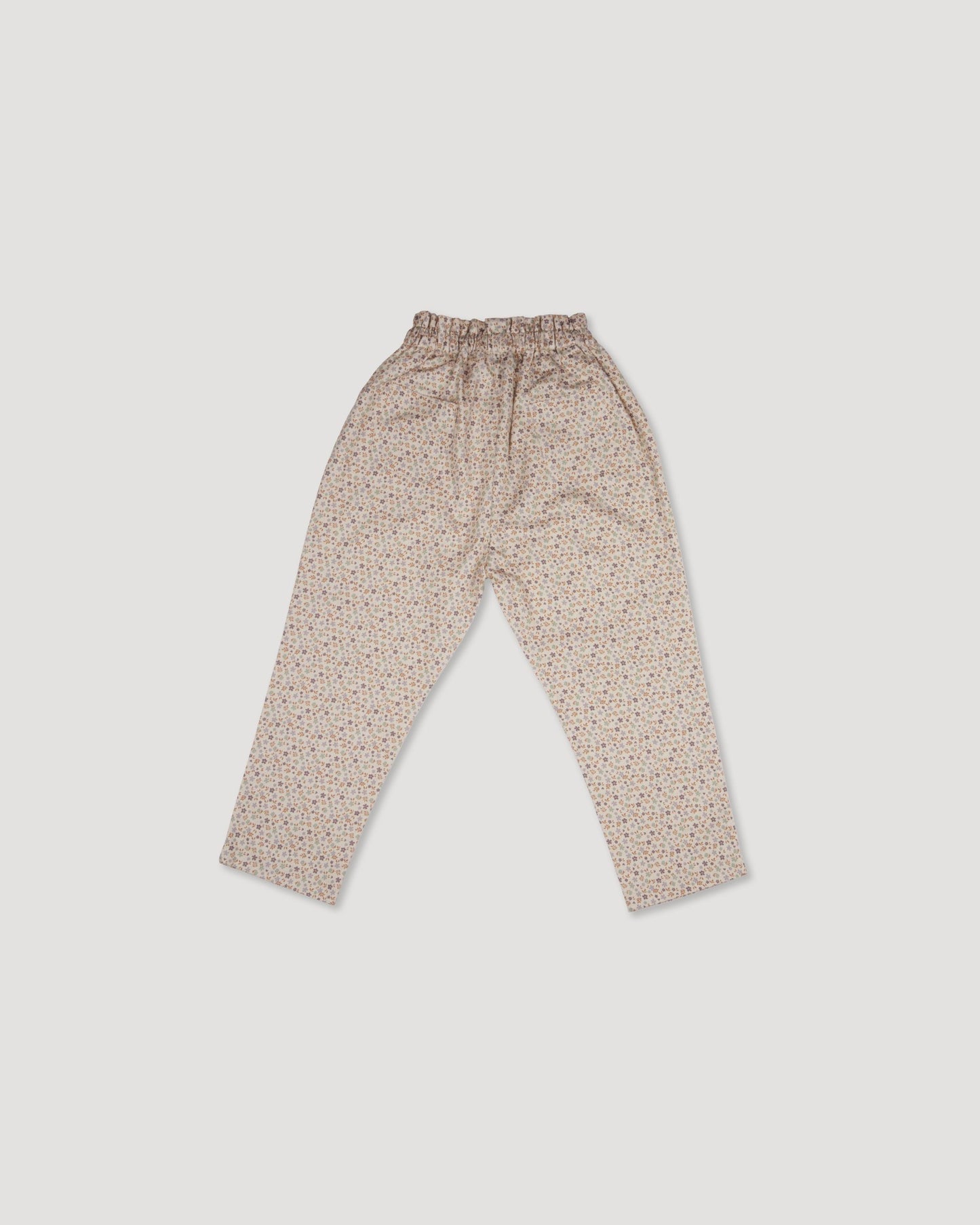 Early Sunday, Adrien Trouser in Floral print, made from Printed 30s Cotton Twill fabric, featuring Relaxed design with ample room for movement, perfect for active kids, shown in a back flat-lay view