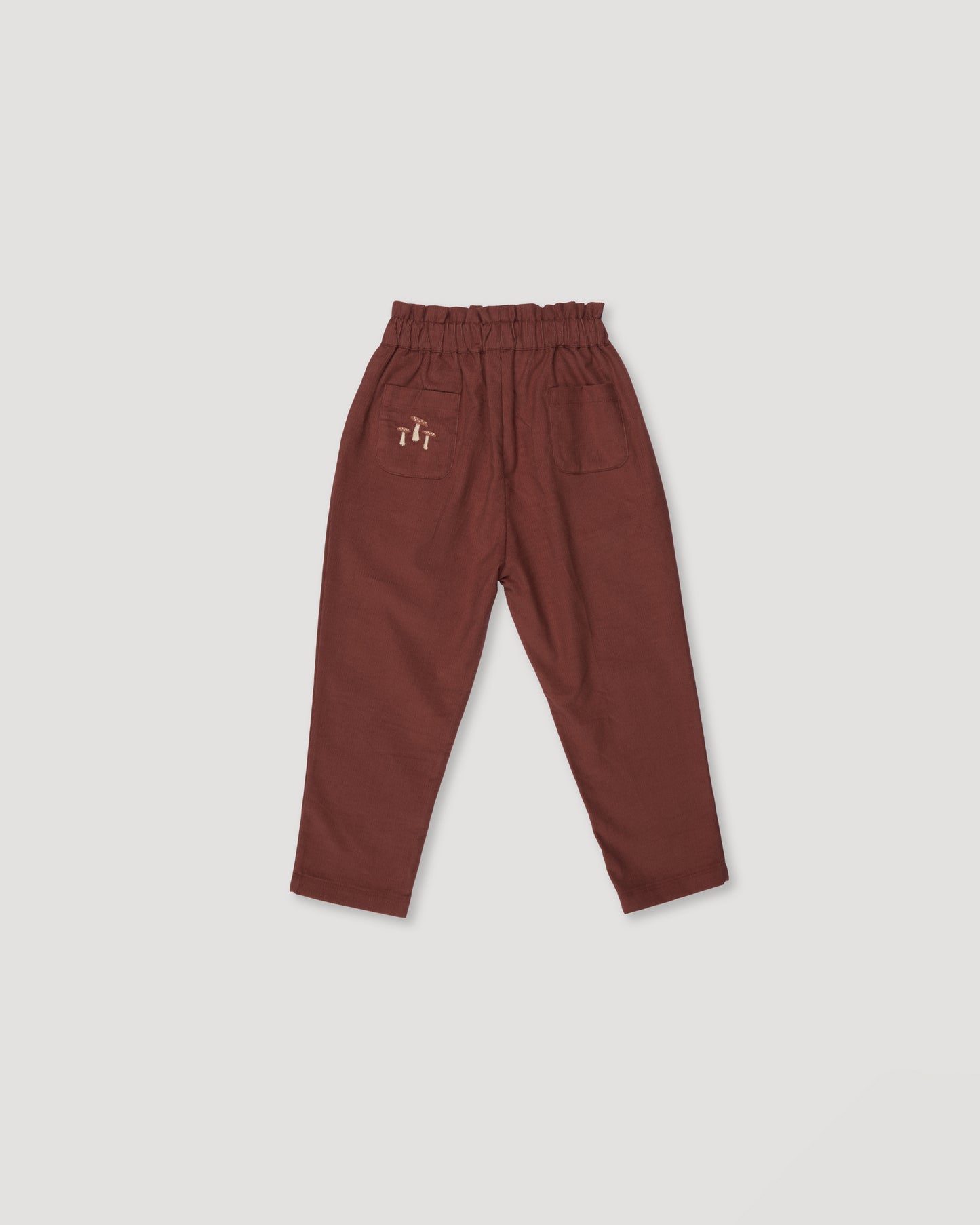 Early Sunday, Adrin Trouser in Caramel, made from Cotton Corduroy fabric, featuring a relaxed silhouette with a comfortable elastic waistband, shown in a back flat-lay view