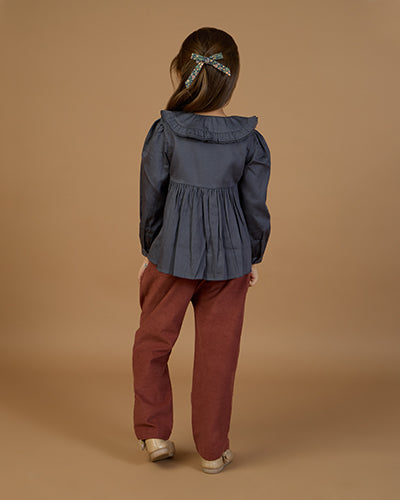 Early Sunday, Adrin Trouser in Caramel, made from Cotton Corduroy fabric, featuring a relaxed silhouette with a comfortable elastic waistband, shown in a back view of model wearing it