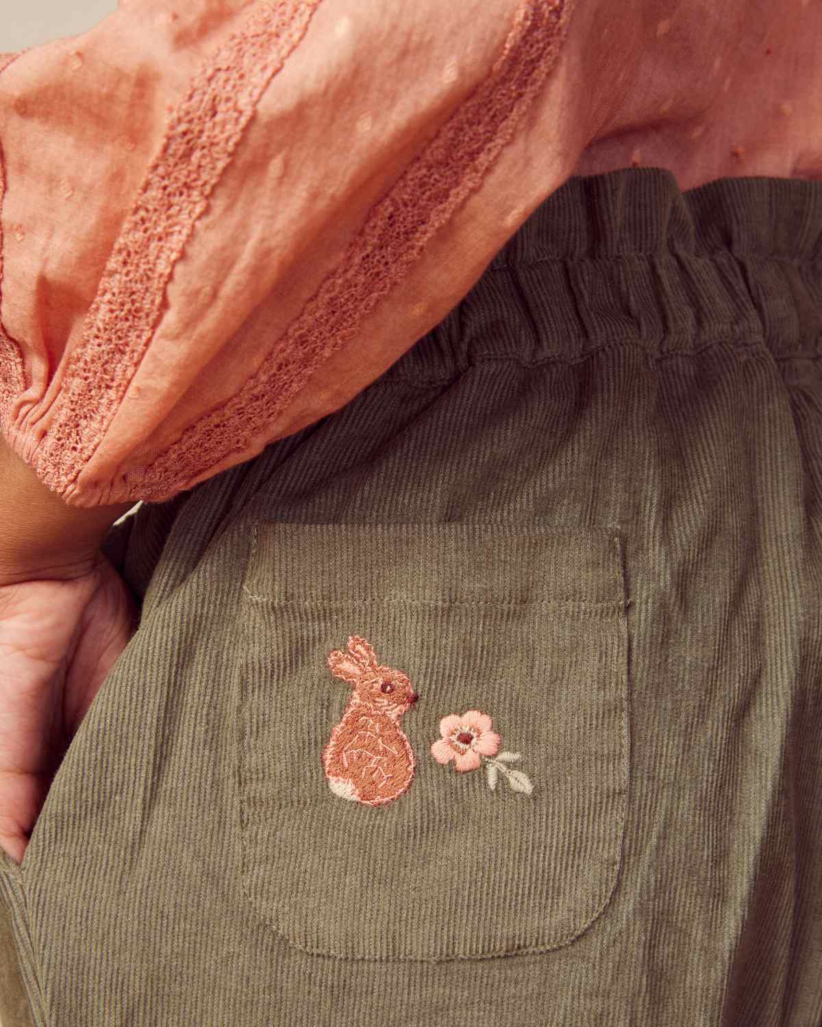 Early Sunday, Adrin Trouser in Moss, made from Cotton Corduroy fabric, featuring a relaxed silhouette with a comfortable elastic waistband, shown in a close-up of print