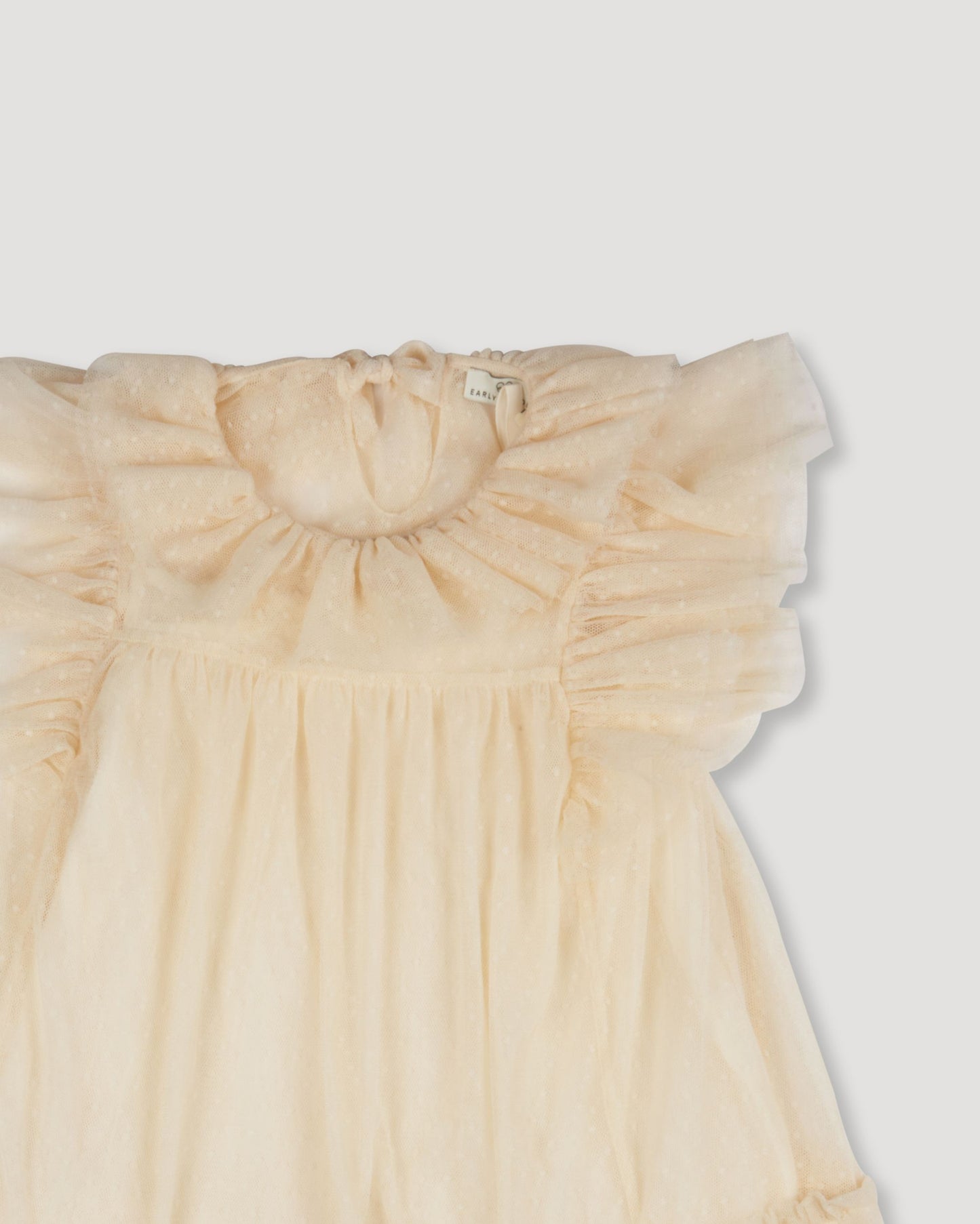 Early Sunday, Angel Baby Dress & Bloomer Set in Hazelnut Cream color, made from Dyed Nylon Mesh Dobby fabric, featuring a dobby mesh, fluttery sleeves & gentle gathers, shown in a closeup flat-lay view