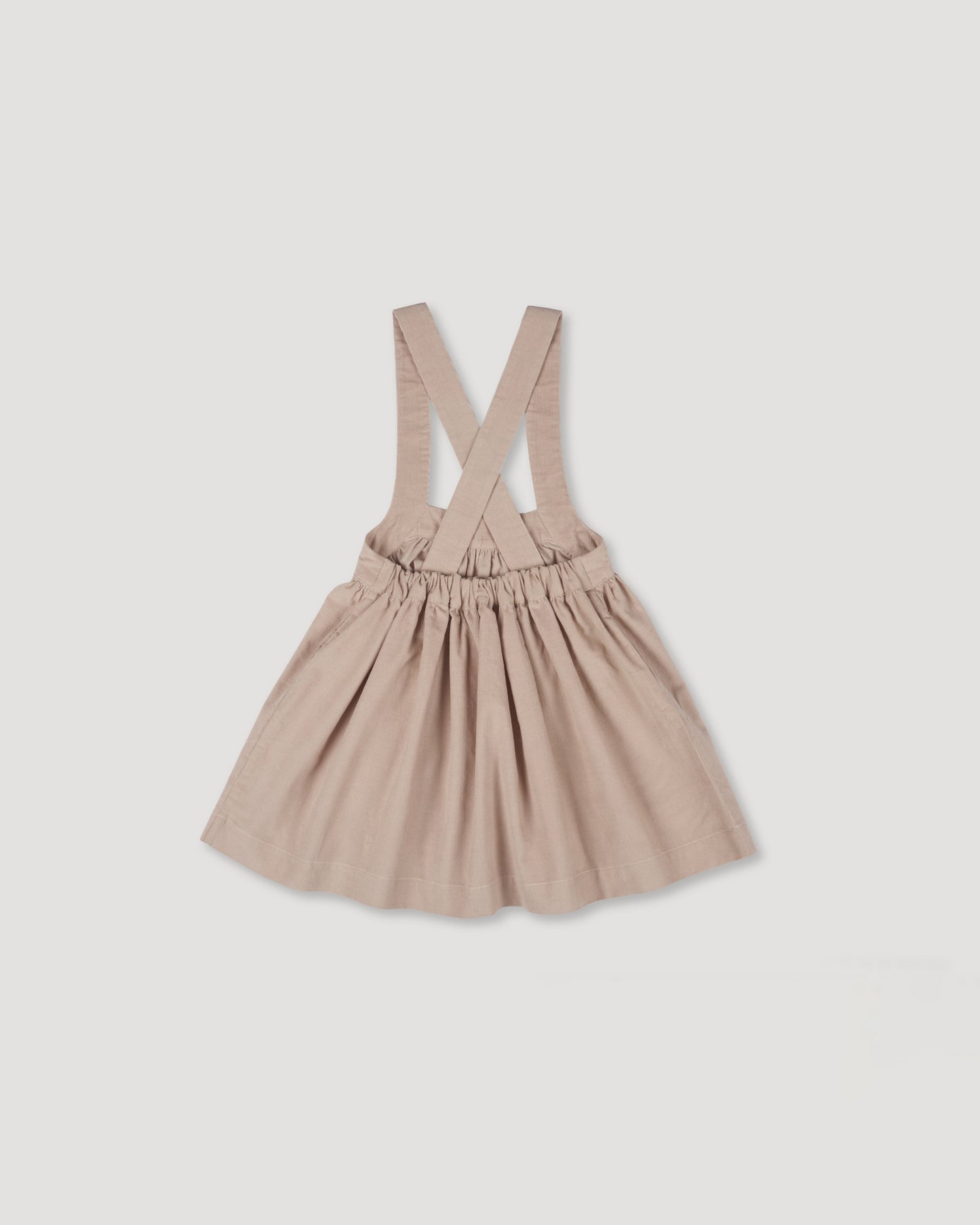 Early Sunday, Annie Skirt in Beige color, made from Cotton Corduroy fabric, featuring a relaxed fit with an elastic waistband & beautiful embroidery, shown in a back flat-lay view