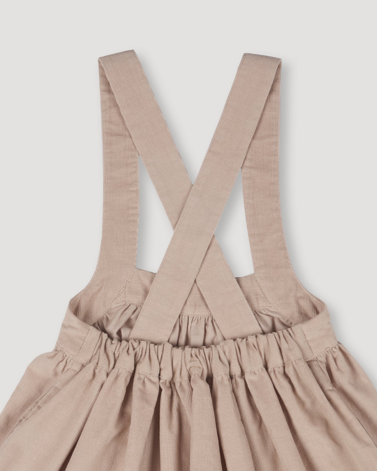 Early Sunday, Annie Skirt in Beige color, made from Cotton Corduroy fabric, featuring a relaxed fit with an elastic waistband & beautiful embroidery, shown in a closeup flat-lay view