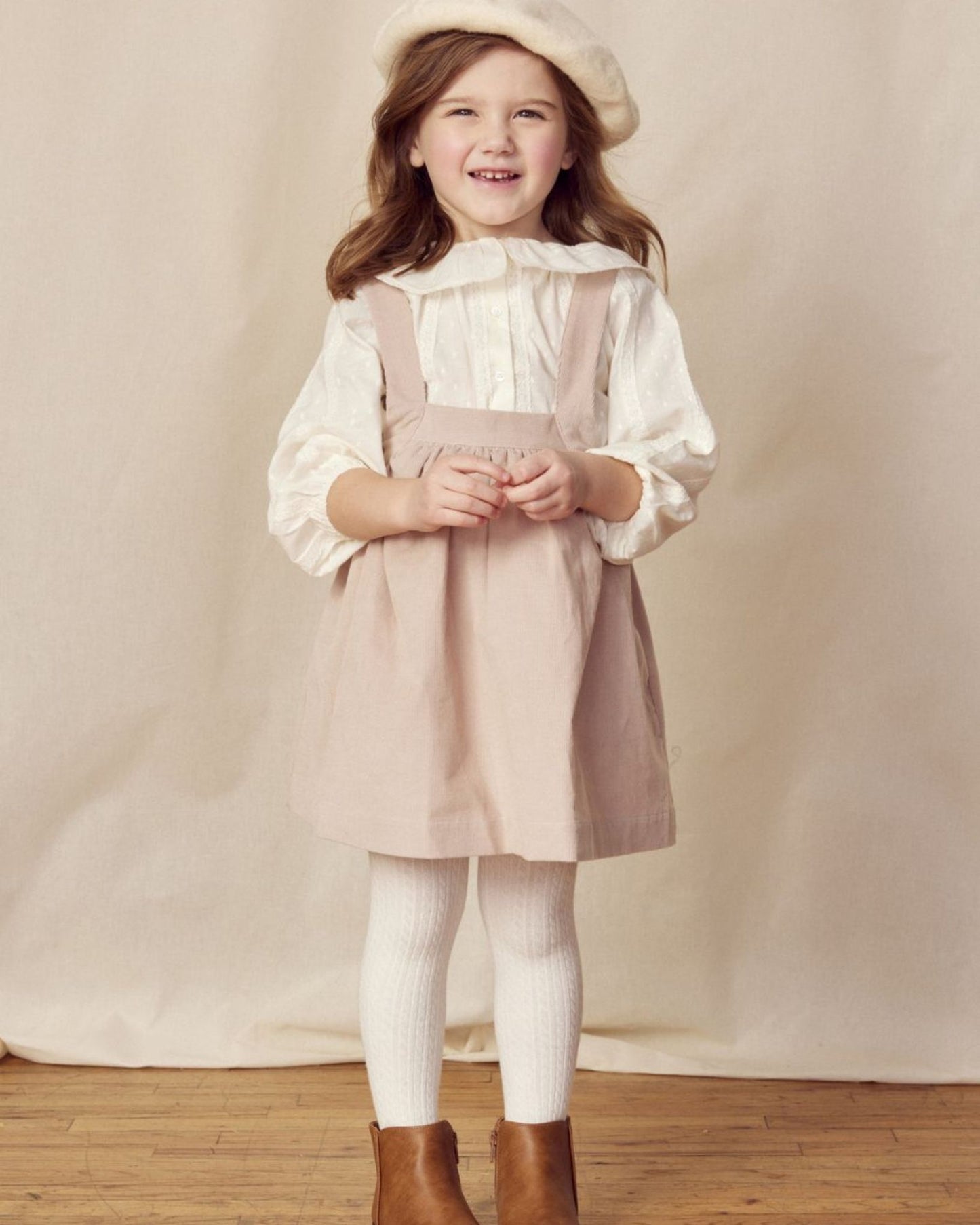 Early Sunday, Annie Skirt in Beige color, made from Cotton Corduroy fabric, featuring a relaxed fit with an elastic waistband & beautiful embroidery, shown in a front view of model wearing it