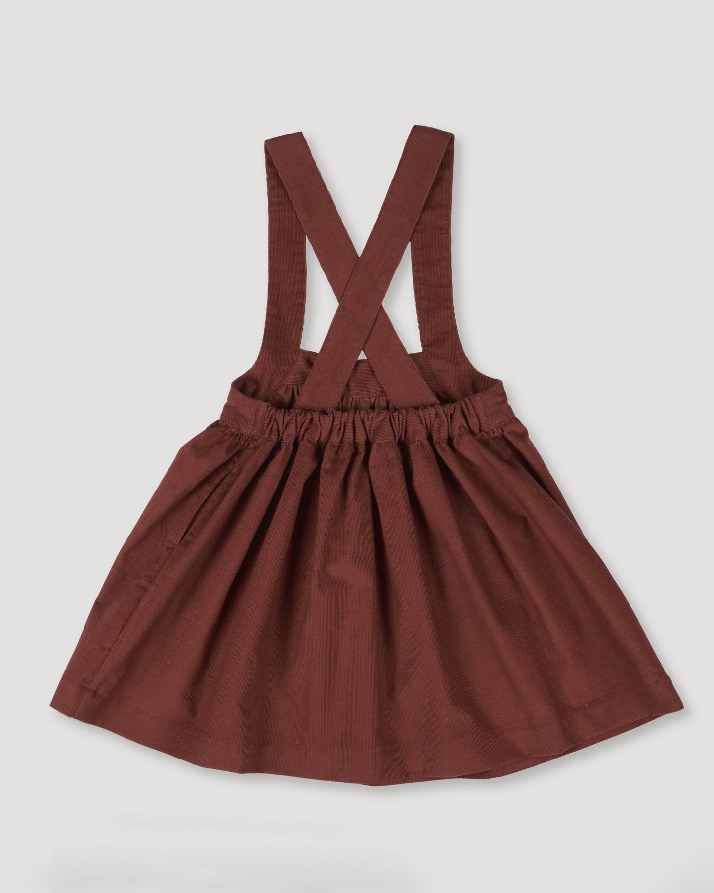 Early Sunday, Annie Skirt in Caramel color, made from Cotton Corduroy fabric, featuring a relaxed fit with an elastic waistband & beautiful embroidery, shown in a back flat-lay view