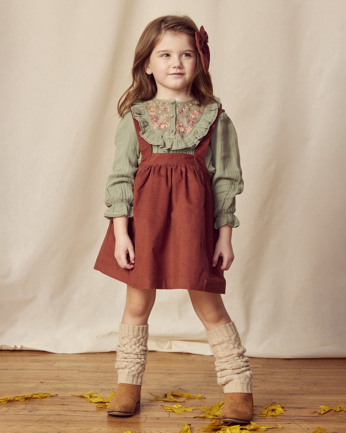 Early Sunday, Annie Skirt in Caramel, made from Cotton Corduroy fabric, featuring a relaxed fit with an elastic waistband & beautiful embroidery, shown in a front view of model wearing it