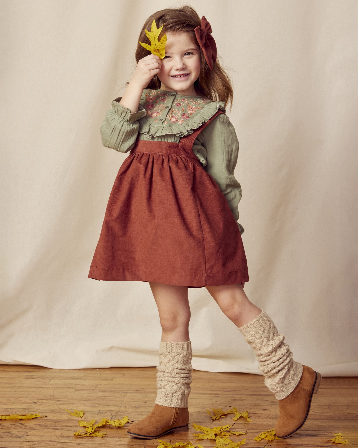 Early Sunday, Annie Skirt in Caramel, made from Cotton Corduroy fabric, featuring a relaxed fit with an elastic waistband & beautiful embroidery, shown in a front view of model wearing it