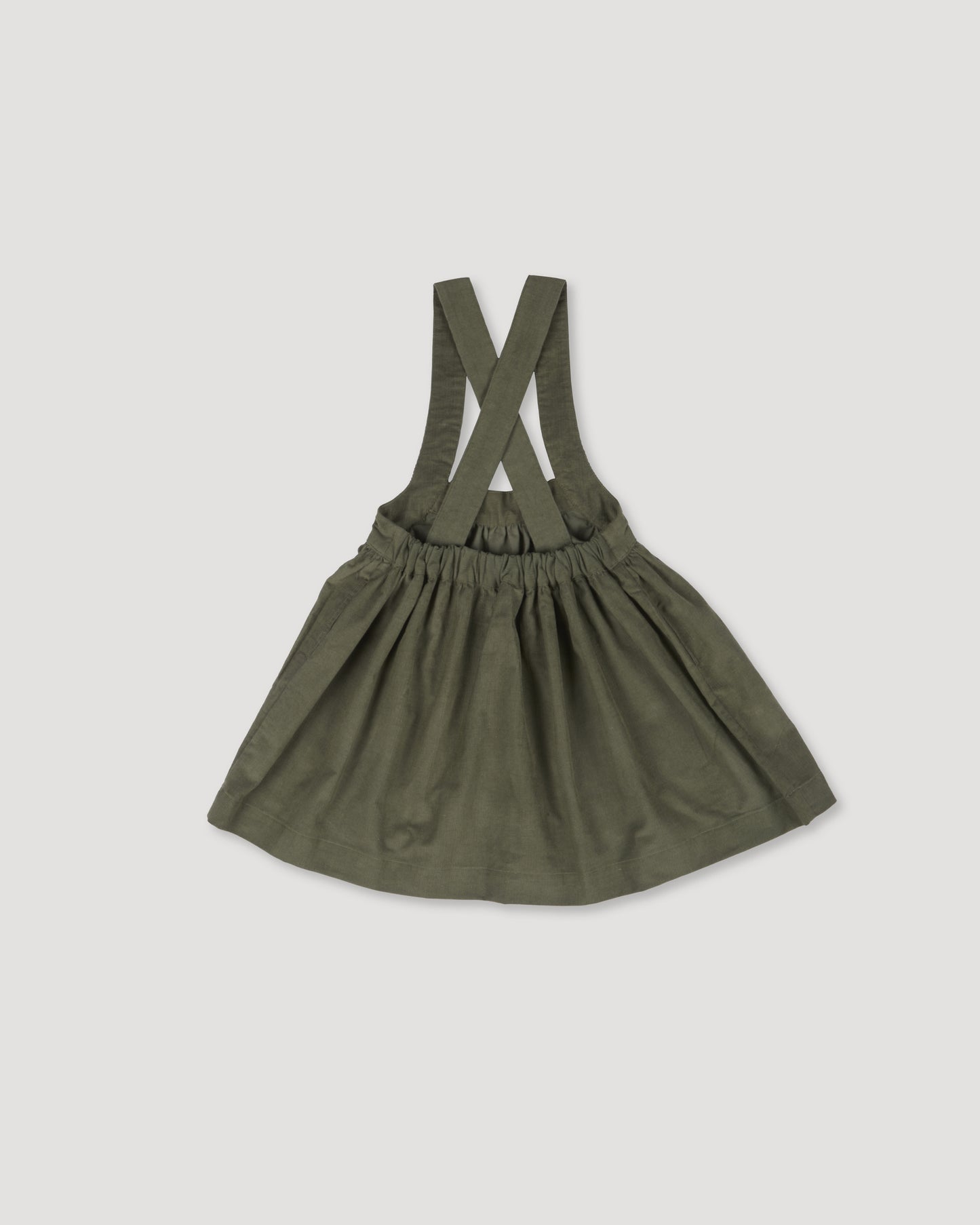 Early Sunday, Annie Skirt in Moss, made from Cotton Corduroy fabric, featuring a relaxed fit with an elastic waistband & beautiful embroidery, shown in a back flat-lay view