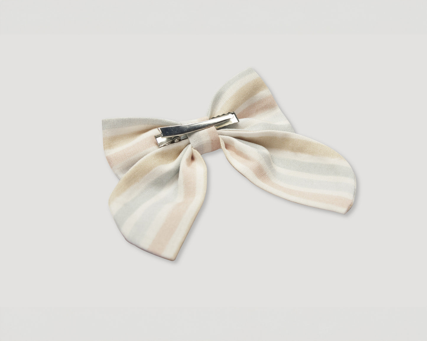 Early Sunday, Audrey Alligator Clip in Summer Stripe, made from Printed canvas 70% Cotton 30% Linen fabric, featuring a fabric bow design with a secure hair clip fastening, shown in a back flat-lay view