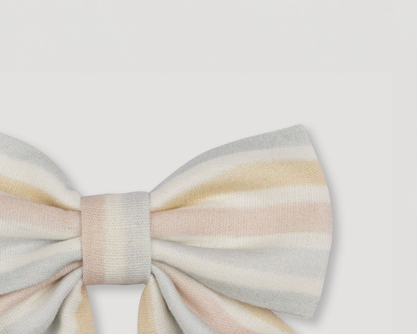Early Sunday, Audrey Alligator Clip in Summer Stripe, made from Printed canvas 70% Cotton 30% Linen fabric, featuring a fabric bow design with a secure hair clip fastening, shown in a closeup flat-lay view