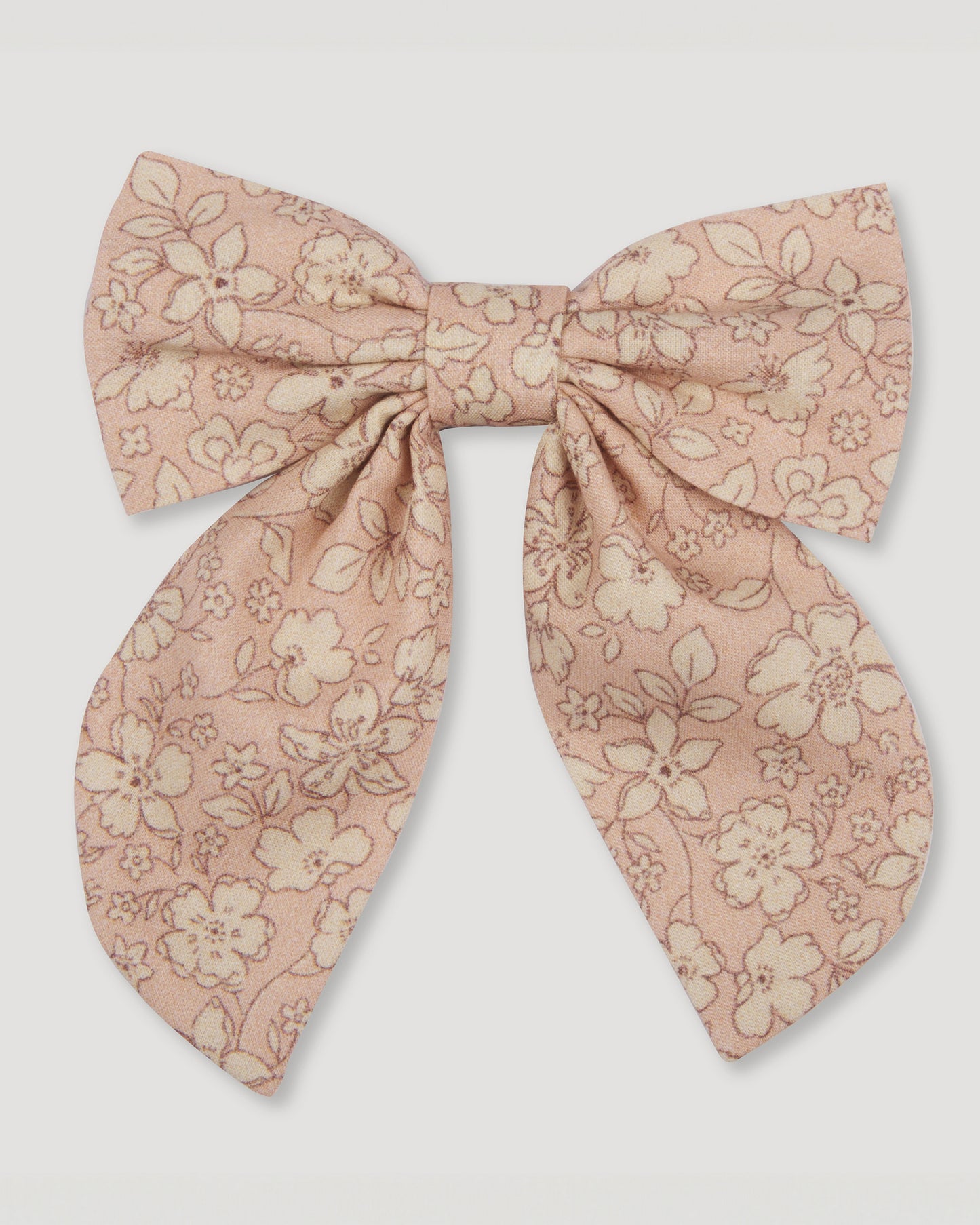 Early Sunday, Audrey Alligator Clip in Garden Flowers print, made from Printed Cotton Cambric fabric, featuring a fabric bow design with a secure hair clip fastening, shown in a front flat-lay view