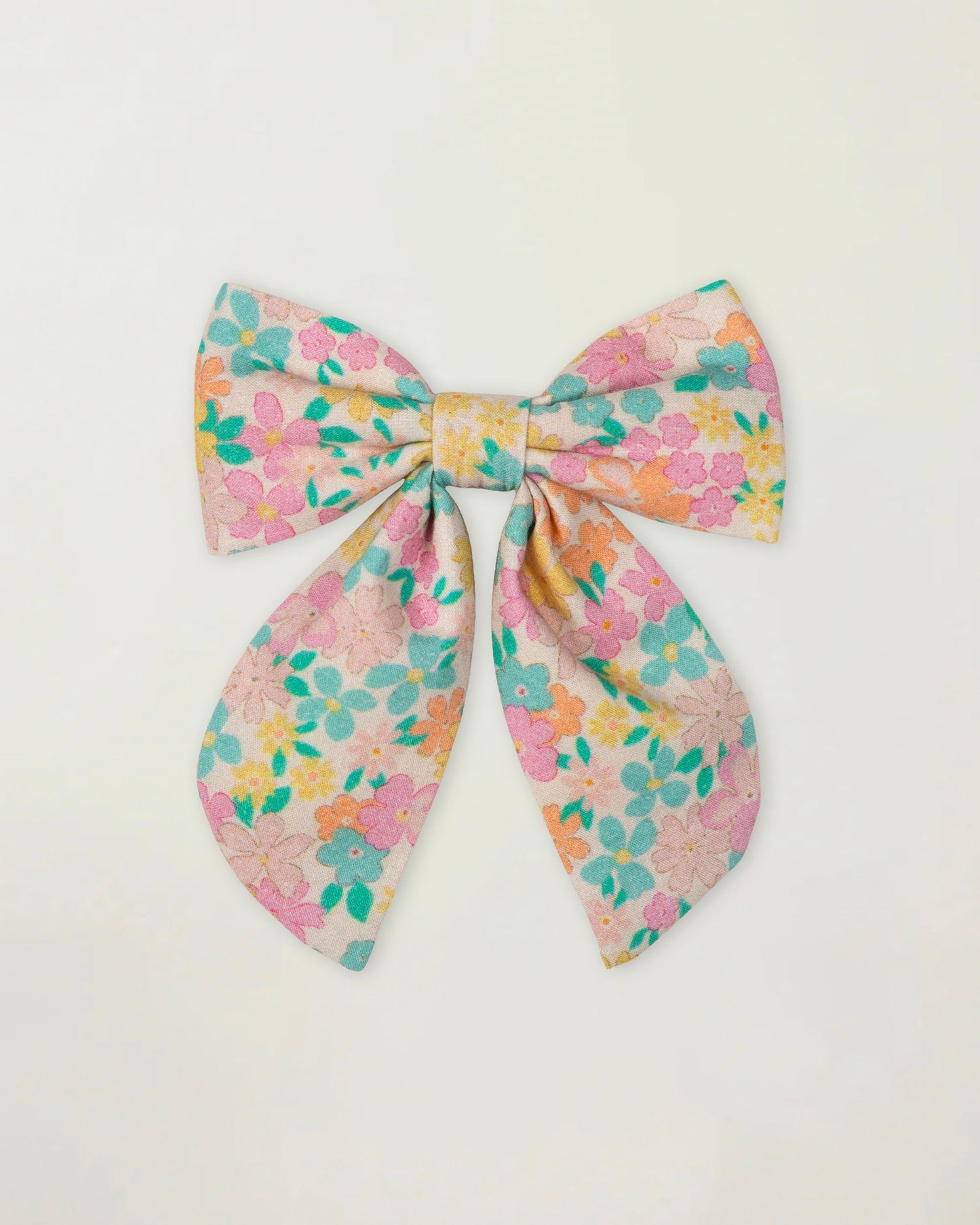 Early Sunday, Audrey Clip in Emma Floral Mint color, made from Organic Printed Cotton Cambric fabric, featuring a fabric bow design with a secure hair clip fastening, shown in a front flat-lay view