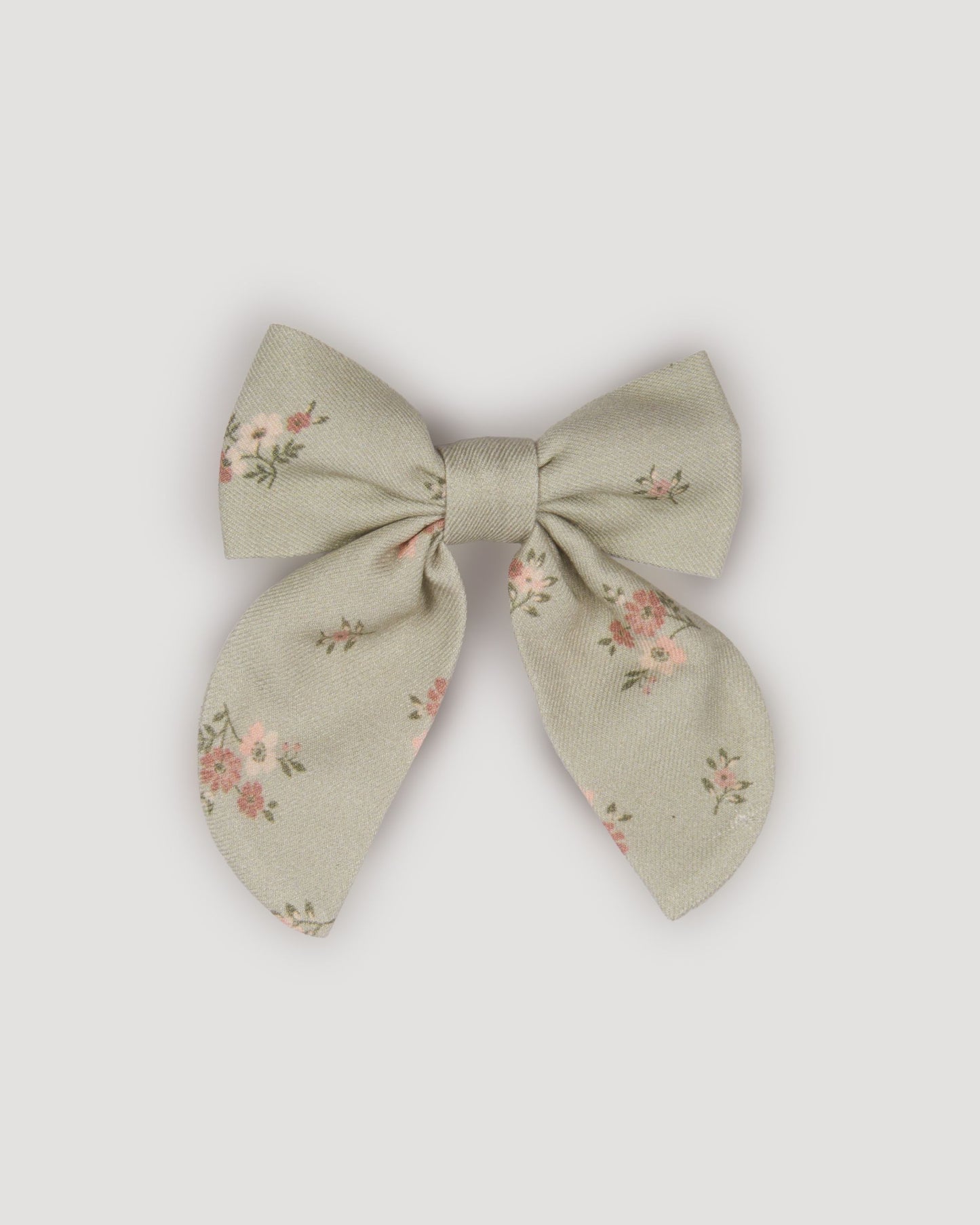 Early Sunday, Audrey Clip in Ditsy Bouquet Jade print, made from Printed Viscose Twill fabric, featuring a fabric bow design with a secure hair clip fastening, shown in a front flat-lay view