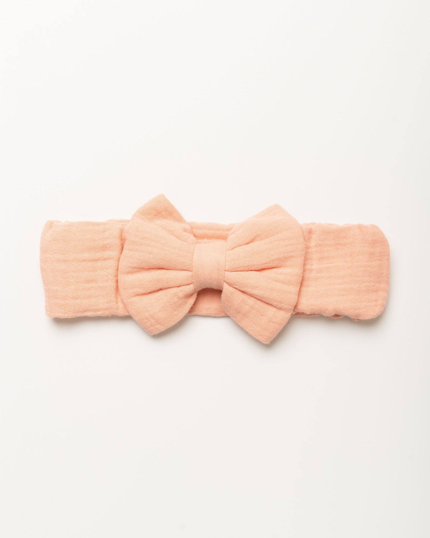 Early Sunday, Baby's Bow Headband in Candy Floss color, made from Cotton Double Gauze fabric, featuring a wide bow design, shown in a front flat-lay view