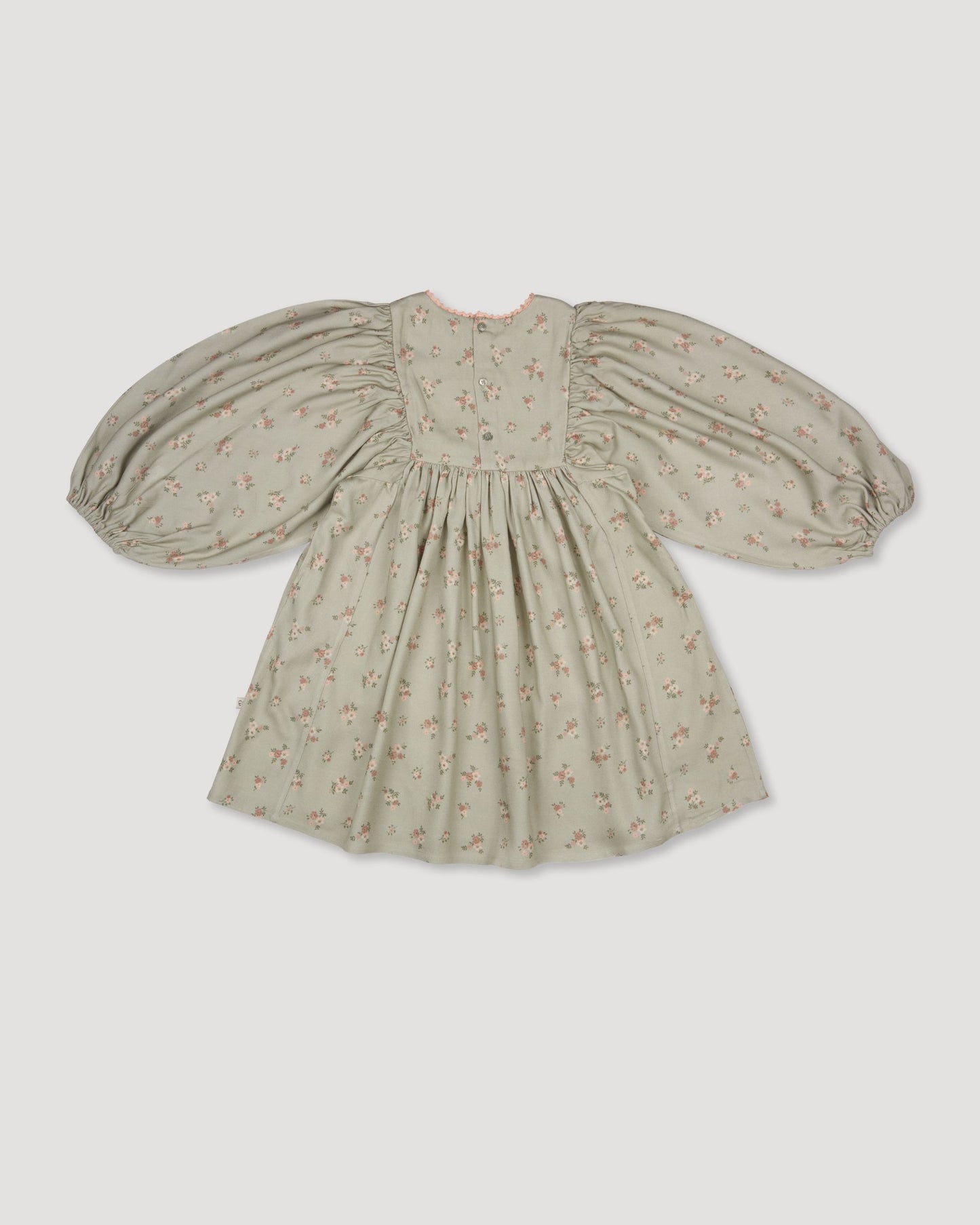 Early Sunday, Belle Dress in Ditsy Bouquet Jade print, made from Printed Viscose Rayon Twill fabric, featuring Hand-embroidered floral bodice with voluminous puff sleeves for a soft, enchanting silhouette, shown in a back flat-lay view