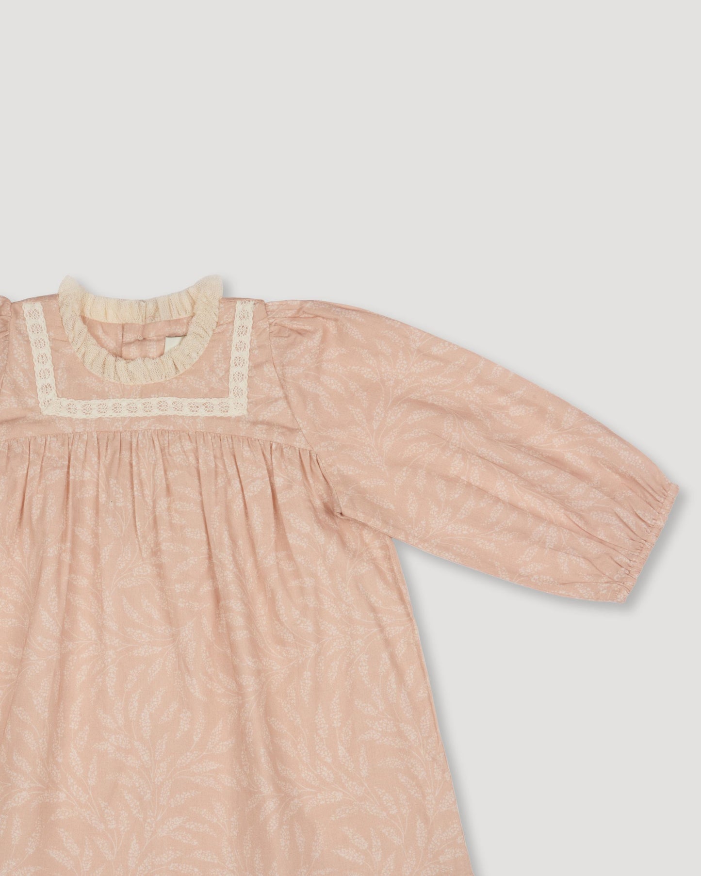 Early Sunday, Billie Baby Dress & Bloomer Set in Feather print, made from Printed 60s Cotton Cambric fabric, featuring long sleeves, lace yoke & a gathered waist with matching bloomers, shown in a closeup flat-lay view