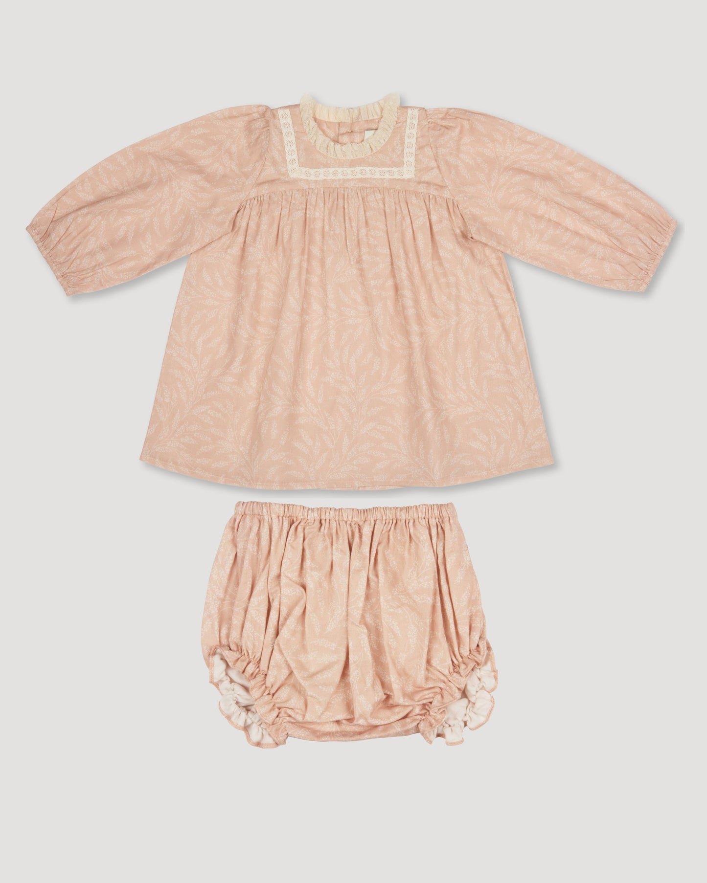 Early Sunday, Billie Baby Dress & Bloomer Set in Feather print, made from Printed 60s Cotton Cambric fabric, featuring long sleeves, lace yoke & a gathered waist with matching bloomers, shown in a front flat-lay view