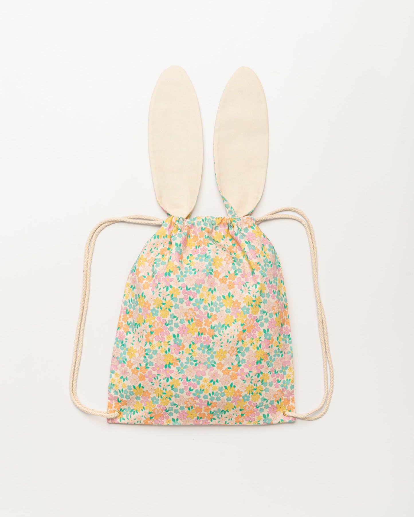 Early Sunday, Bunny Drawstring Backpack in Emma Floral Mint color, made from Organic Printed Cotton Cambric fabric, featuring a bunny-ear design with a drawstring closure, shown in a back flat-lay view