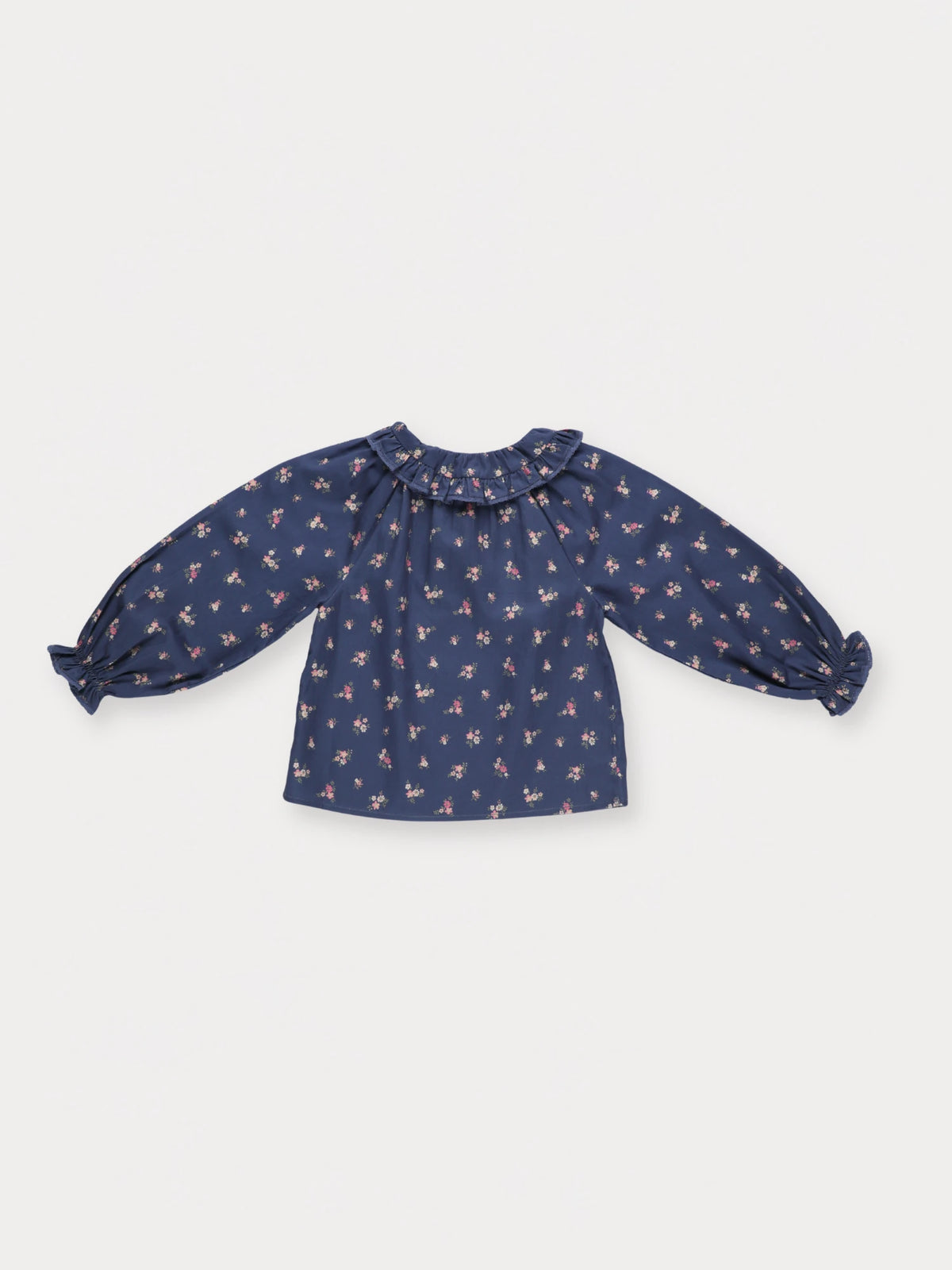 Early Sunday, Cécile Blouse in Ditsy Bouquet Navy, made from Printed Cotton Satin fabric, featuring a relaxed silhouette with gathered sleeves and delicate detailing, shown in a back flat-lay view