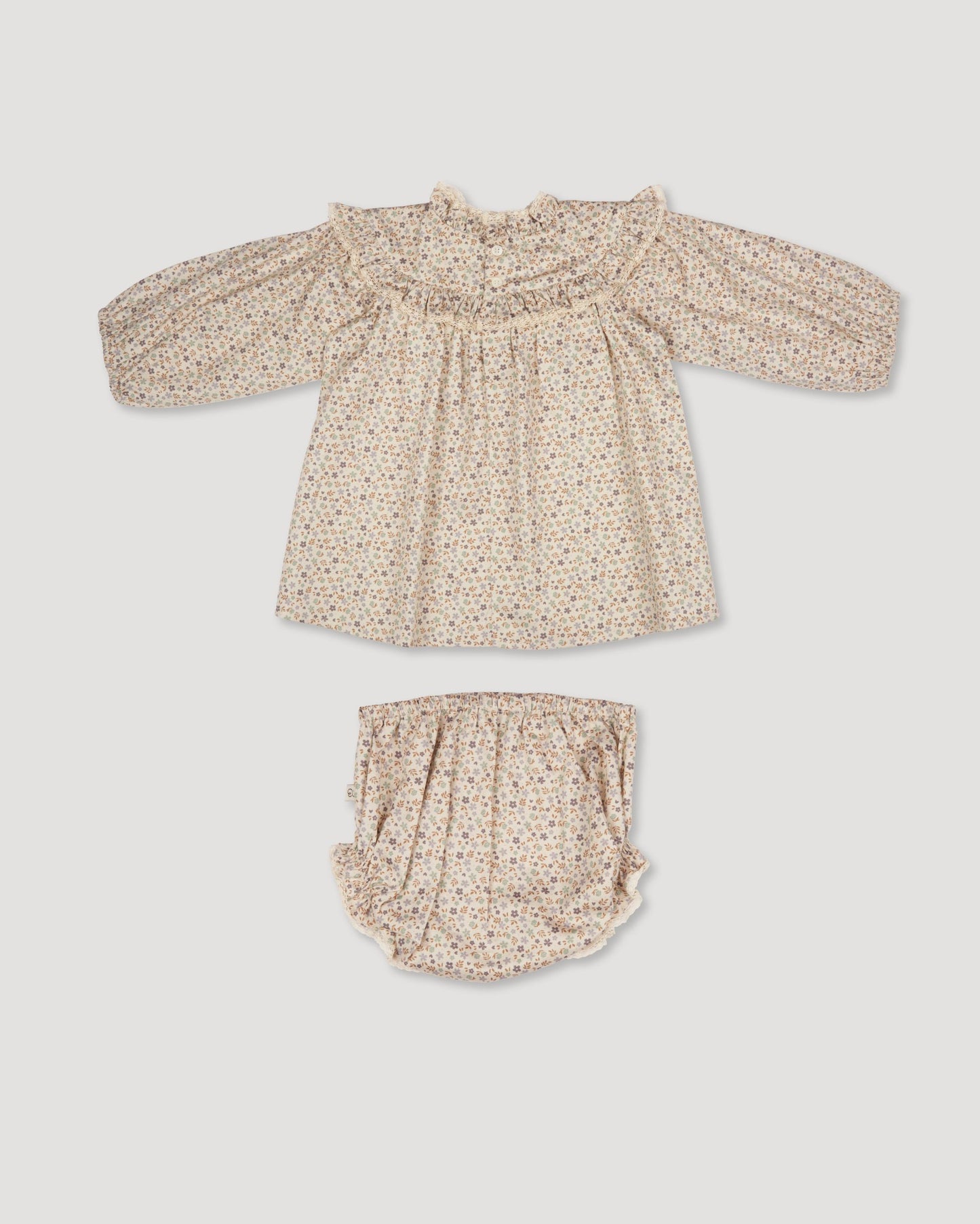 Early Sunday, Charlie Baby Dress & Bloomer Set in Mini Flowers print, made from Printed 60s Cotton Satin fabric, featuring long sleeves with rufflled lace & matching bloomers, shown in a back flat-lay view