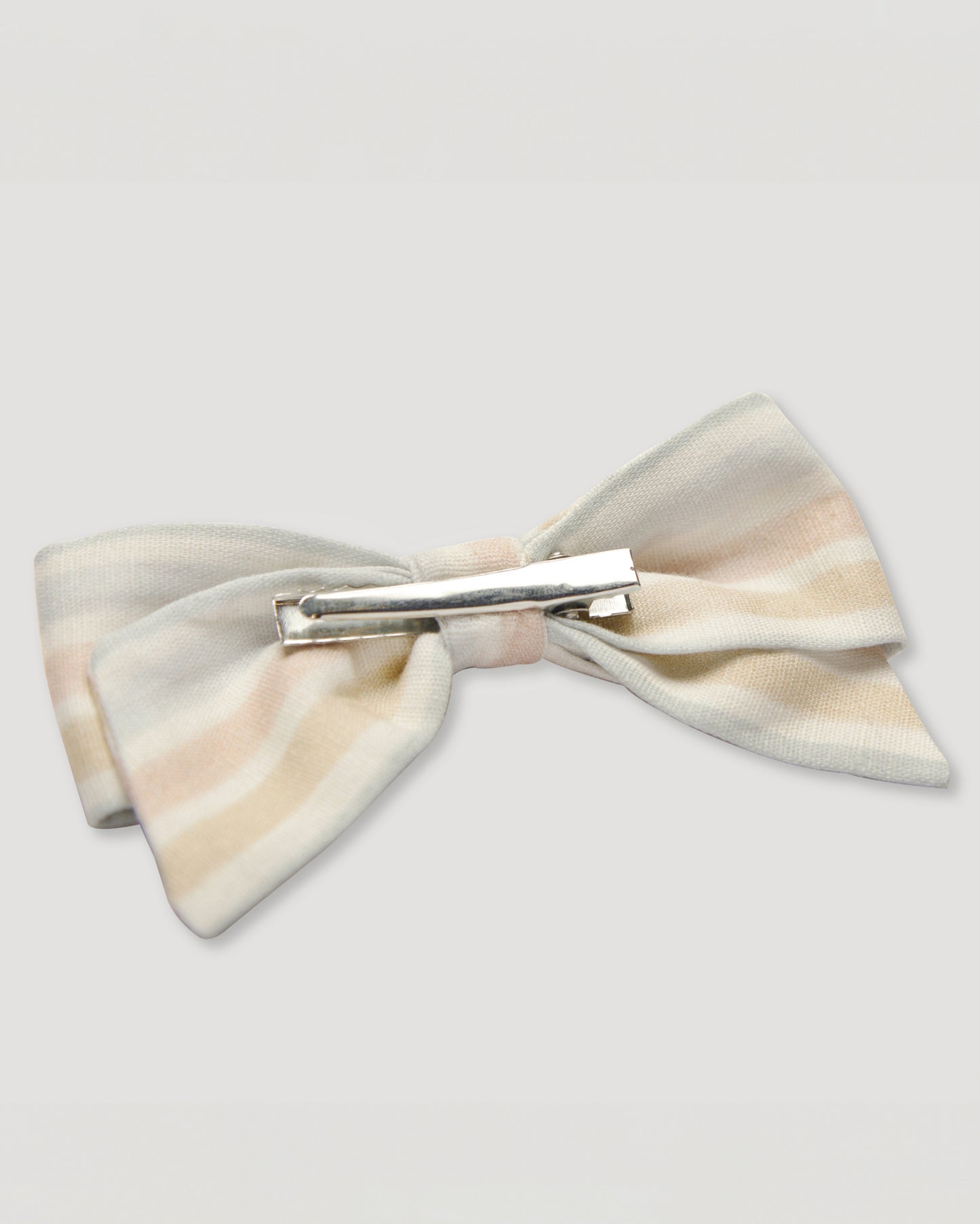 Early Sunday, Chiara Alligator Clip in Mini Flower print, made from Printed canvas 70% Cotton 30% Linen fabric, featuring a bow design on an alligator clip with a secure fit, shown in a back flat-lay view