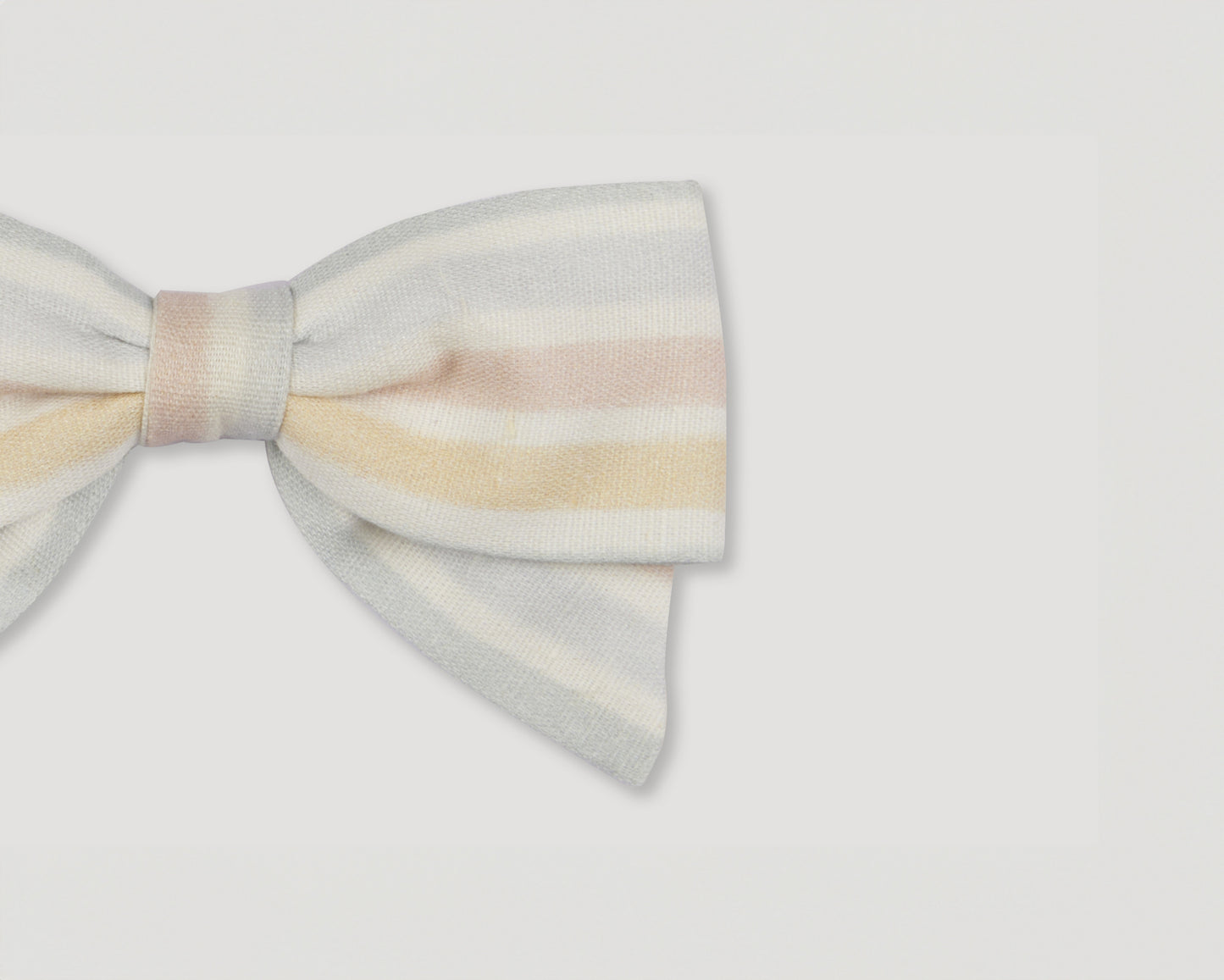Early Sunday, Chiara Alligator Clip in Mini Flower print, made from Printed canvas 70% Cotton 30% Linen fabric, featuring a bow design on an alligator clip with a secure fit, shown in a closeup flat-lay view