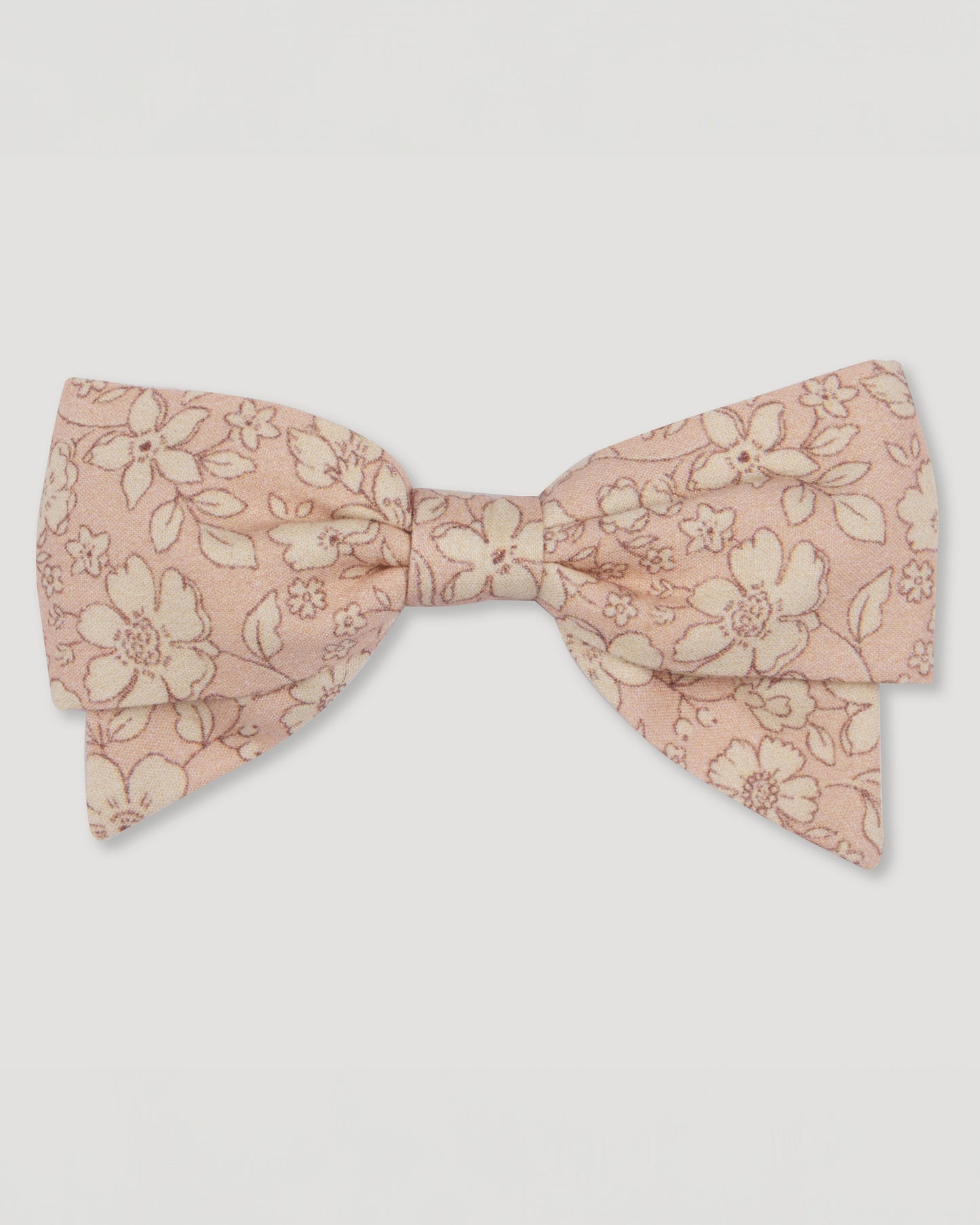 Early Sunday, Chiara Alligator Clip in Garden Flowers print, made from Printed Cotton Cambric fabric, featuring a bow design on an alligator clip with a secure fit, shown in a front flat-lay view