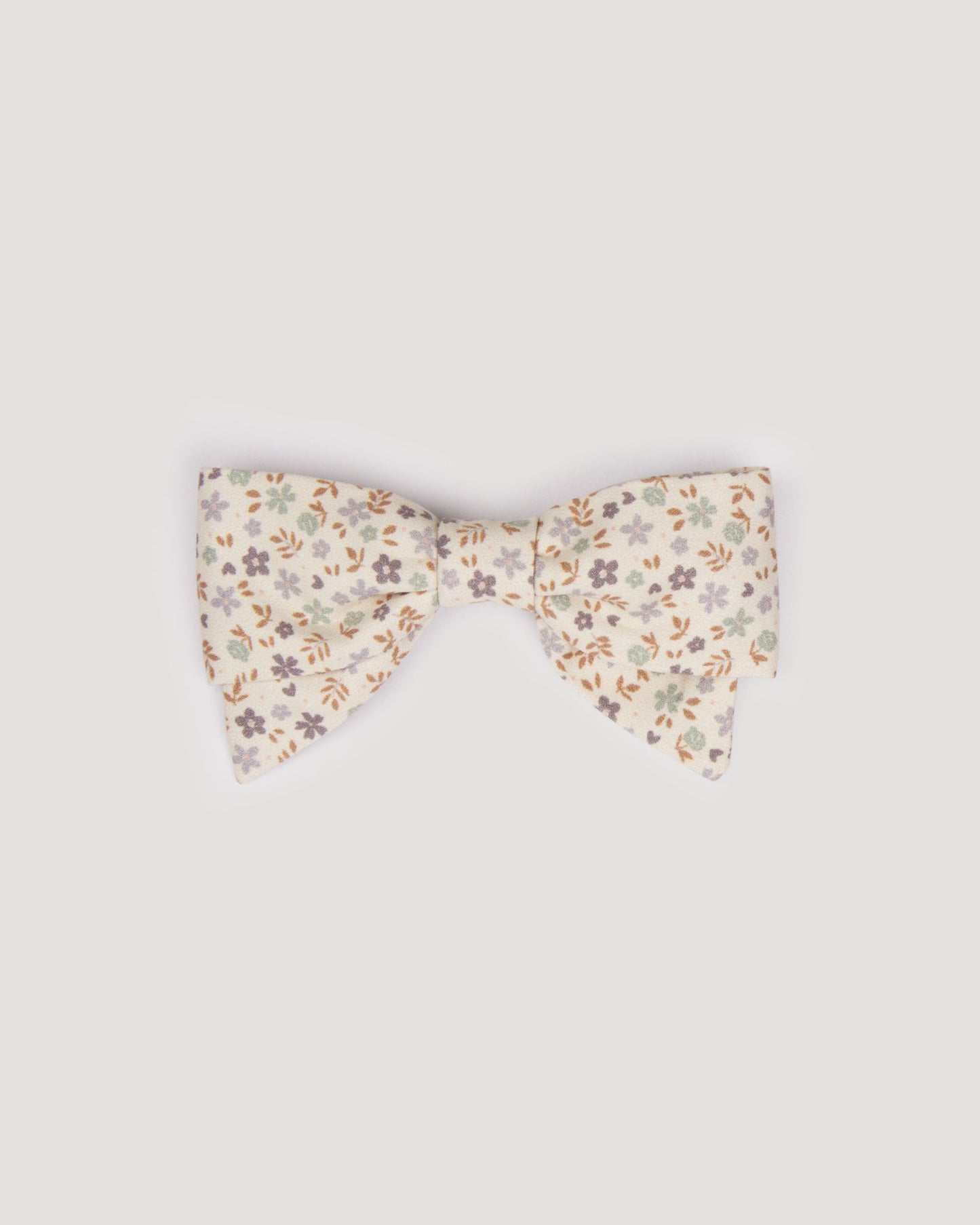 Early Sunday, Chiara Clip in Mini Flowers print, made from Printed 60s Cotton Satin fabric, featuring a bow design on an alligator clip with a secure fit, shown in a front flat-lay view