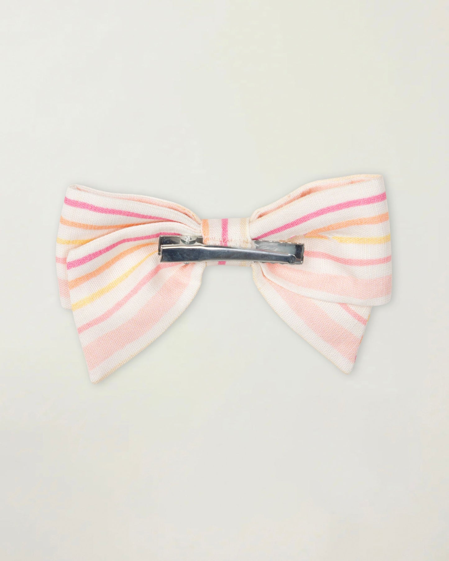 Early Sunday, Chiara Clip in Pink Stripes print, made from Printed 70% Cotton, 30% Linen fabric, featuring a bow design on an alligator clip with a secure fit, shown in a back flat-lay view