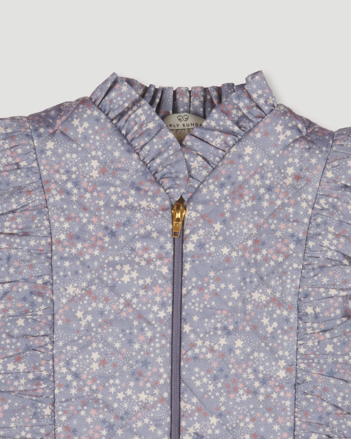 Early Sunday, Deborah Jacket in Celestial print, made from Printed 30s Cotton Twill fabric, featuring Sleeveless design ideal for versatile layering in transitional weather, shown in a closeup flat-lay view