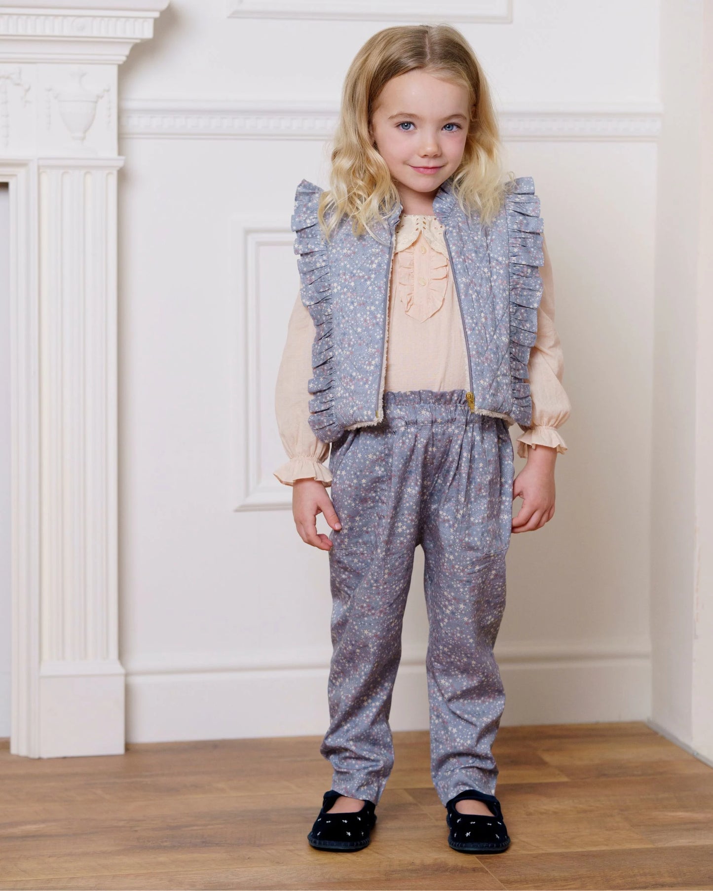 Early Sunday, Deborah Jacket in Celestial print, made from Printed 30s Cotton Twill fabric, featuring Sleeveless design ideal for versatile layering in transitional weather, shown in a front view of model wearing it