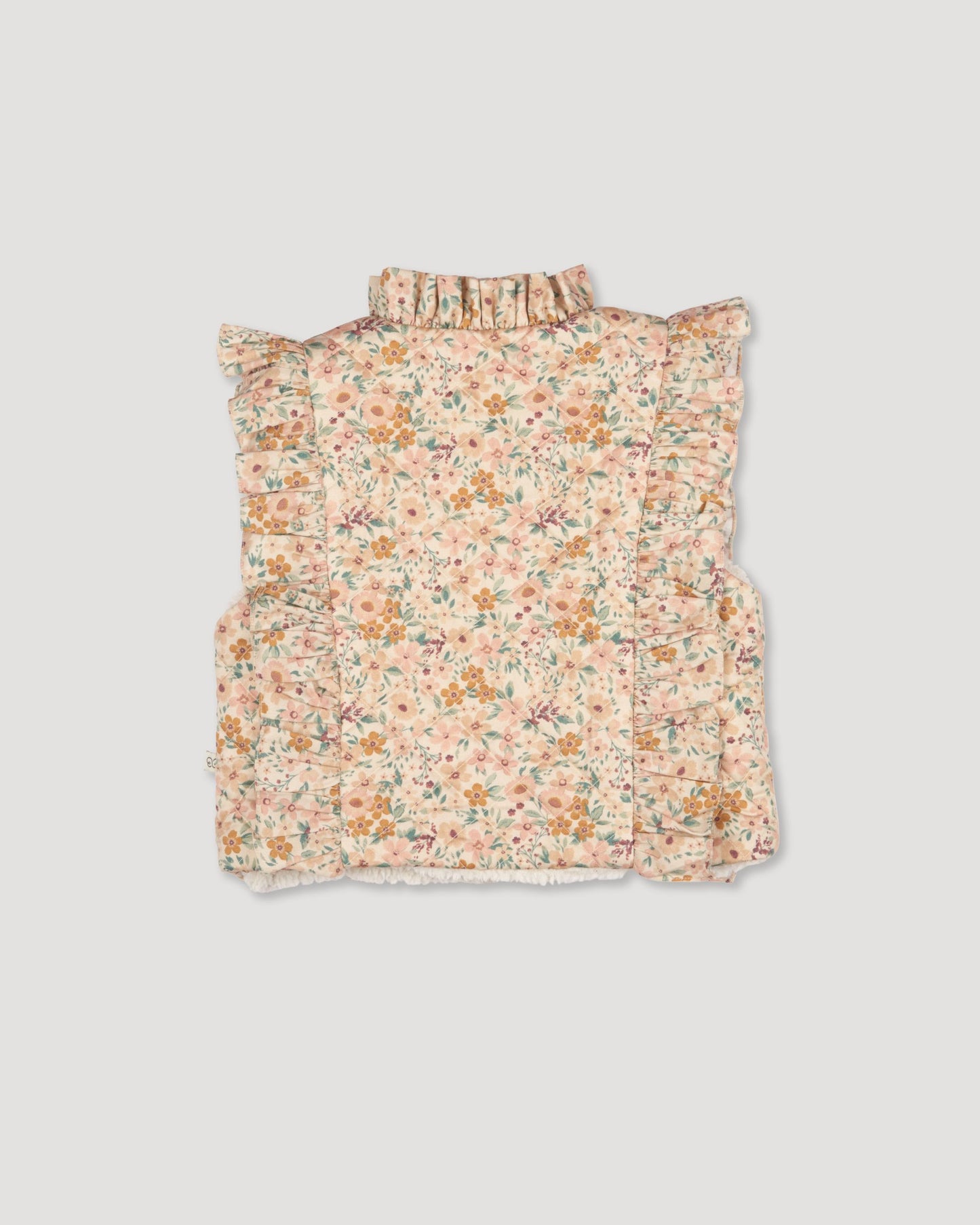Early Sunday, Deborah Jacket in Floral print, made from Printed 30s Cotton Twill fabric, featuring Sleeveless design ideal for versatile layering in transitional weather, shown in a back flat-lay view