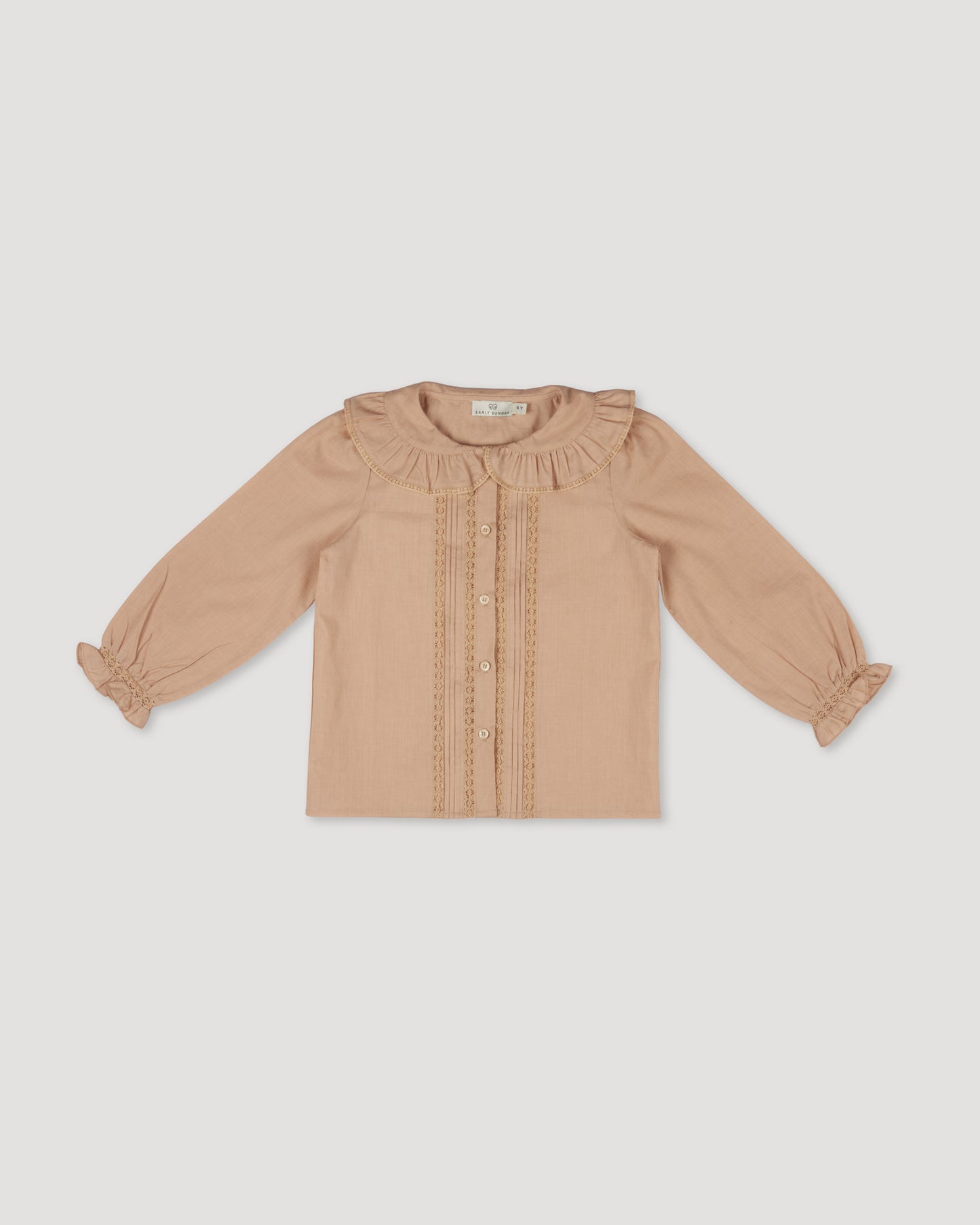 Early Sunday, Ella Blouse in Nude, made from Cotton Cambric fabric, featuring relaxed fit, frill detailing on the collar, and lace inserts, shown in a front flat-lay view