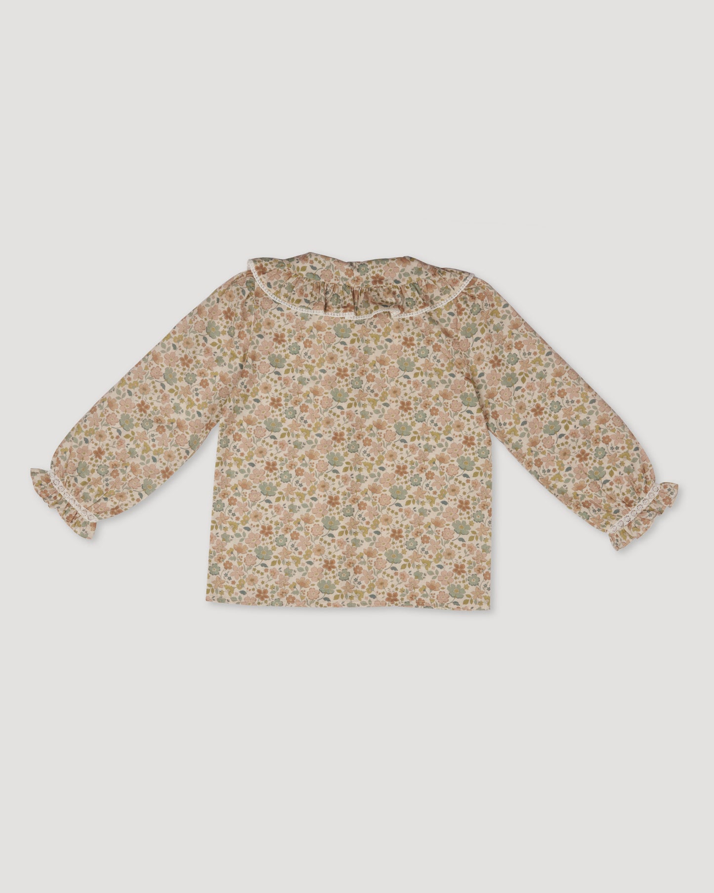 Early Sunday, Ella Blouse in Garden Flowers Cream, made from Printed Cotton Cambric fabric, featuring relaxed fit, frill detailing on the collar, and lace inserts, shown in a back flat-lay view