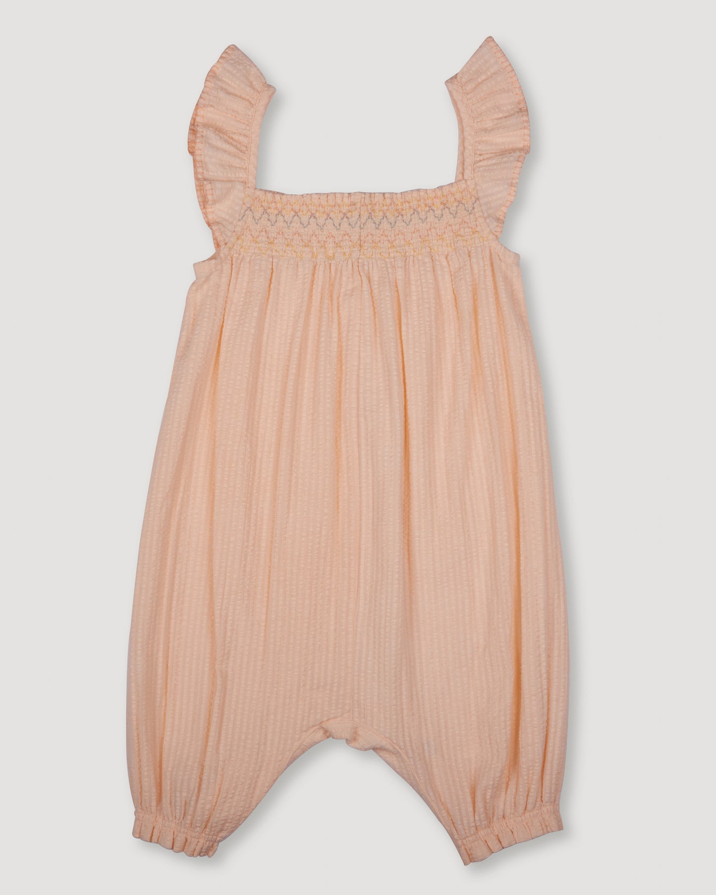 Early Sunday, Emma Baby Smocked Overalls Romper in Warm Sand color, made from Cotton Seersucker fabric, featuring a relaxed fit with smocked chest band & frilled sleeves, shown in a front flat-lay view