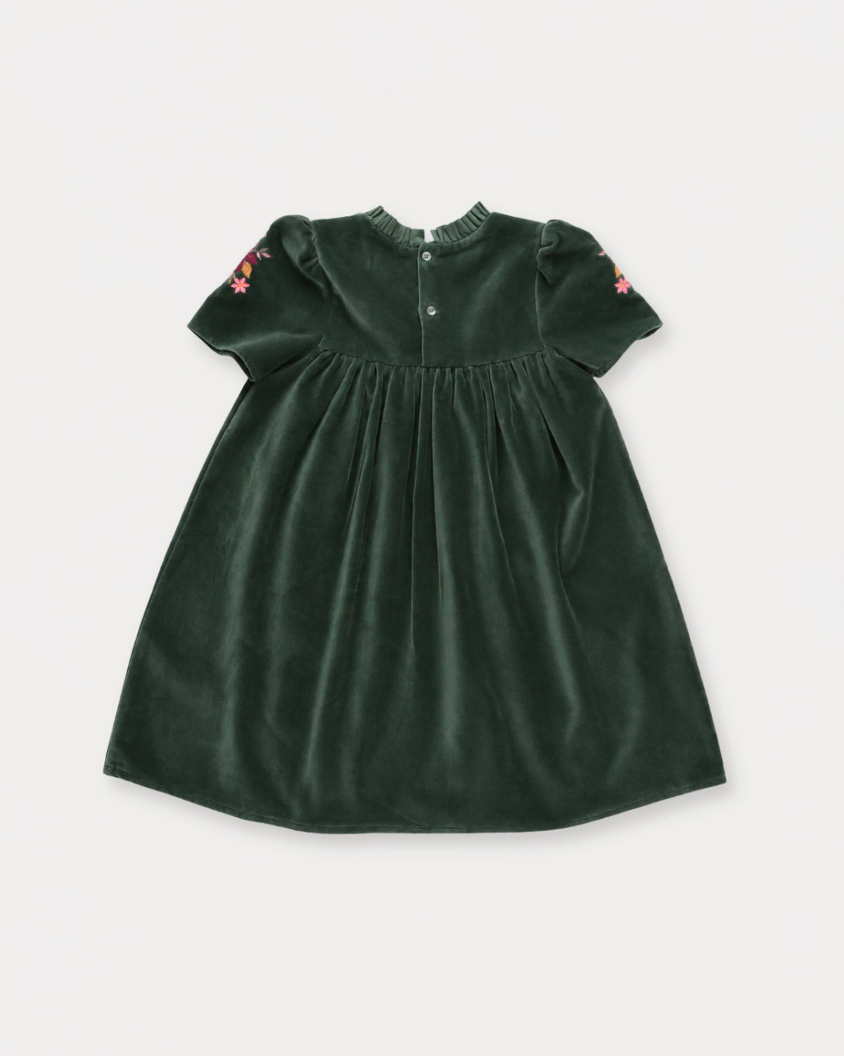 Early Sunday, Erika Dress in Forest Green, made from Cotton Velvet Velour's fabric, featuring a beautiful embroidery with frilled neckline, shown in a back flat-lay view