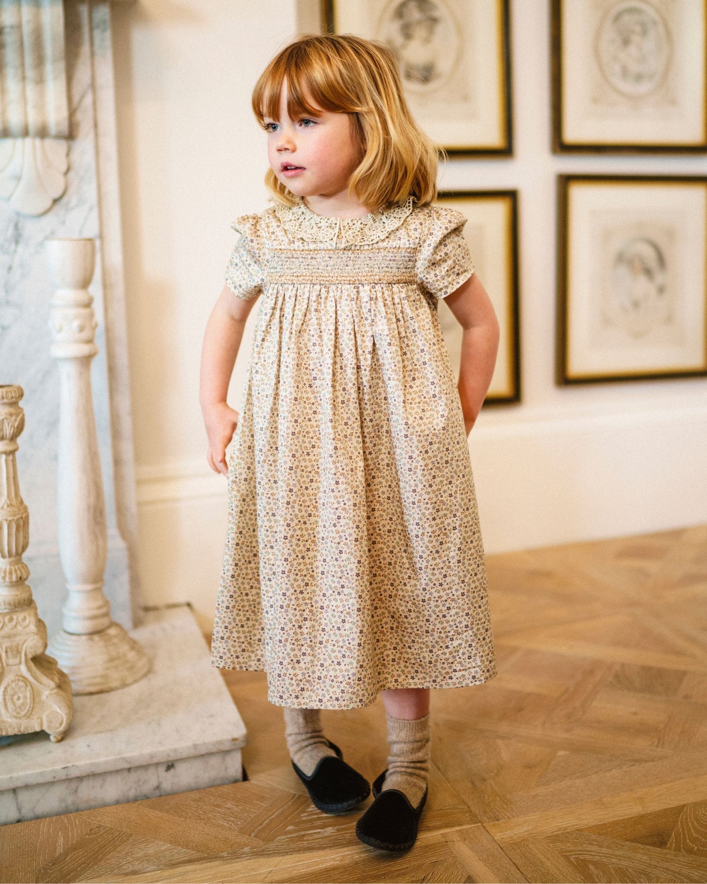 Early Sunday, Erika Dress in Miny Flowers print, made from Printed Cotton Satin fabric, featuring Flowy A-line silhouette allows ease of movement and day-long comfort, shown in a front view of a model wearing it in a studio setting