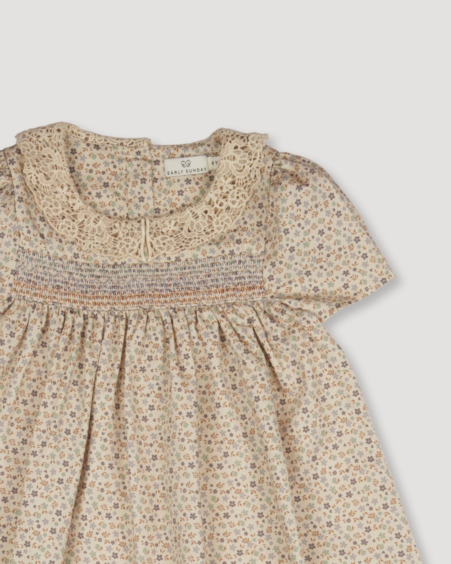 Early Sunday, Erika Dress in Miny Flowers print, made from Printed Cotton Satin fabric, featuring Flowy A-line silhouette allows ease of movement and day-long comfort, shown in a closeup flat-lay view