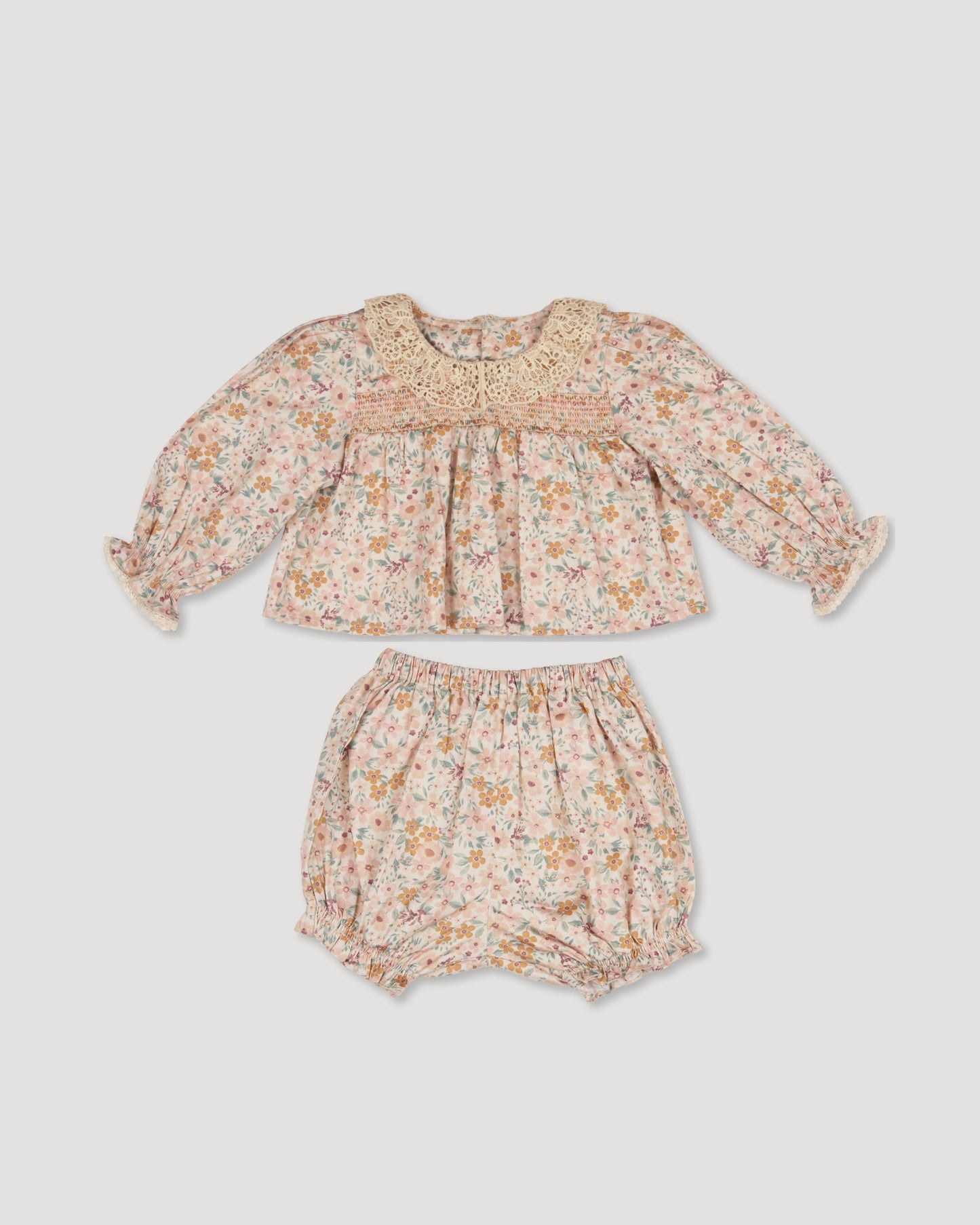 Early Sunday, Essie & Pippy Baby Set in Floral print, made from Printed 60s Cotton Satin fabric, featuring smocked sleeves with laced neckline & matching bloomers, shown in a front flat-lay view