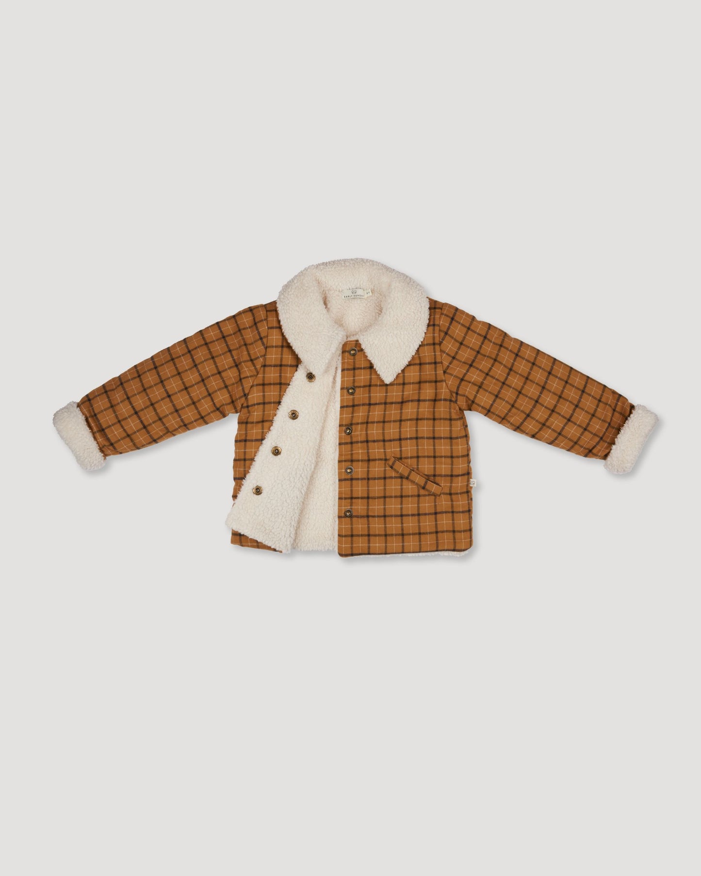 Early Sunday, Franka Jacket in Almond Checks, made from Cotton Yarn Dyed Brushed Checks fabric, featuring Cozy, softly structured jacket with a plush sherpa lining and gentle detailing for warmth without bulk, shown in a closeup flat-lay view
