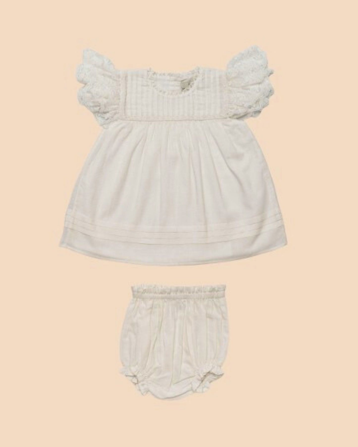 Early Sunday, Grace Baby Dress & Bloomer Set in Ivory color, made from 100% Cotton Swiss Dobby fabric, featuring a sleeveless design with wide shoulder straps & matching bloomers, shown in a front flat-lay view