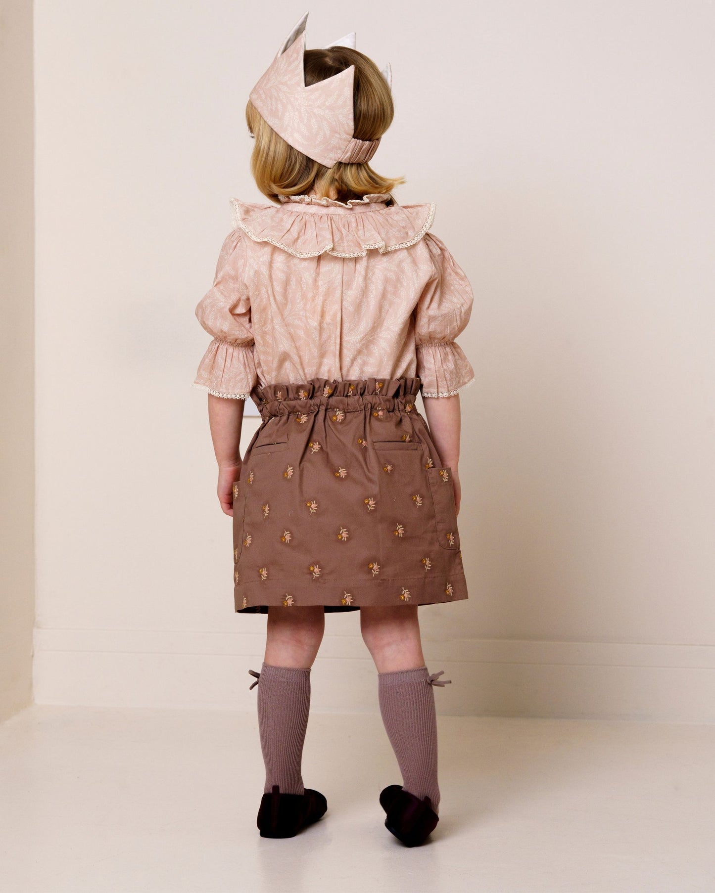 Early Sunday, Hilda Skirt in Bark, made from All-over embroidered 30s cotton brushed twill fabric, featuring A-line shape with a gathered elastic waistband for comfort, shown in a close-up of print