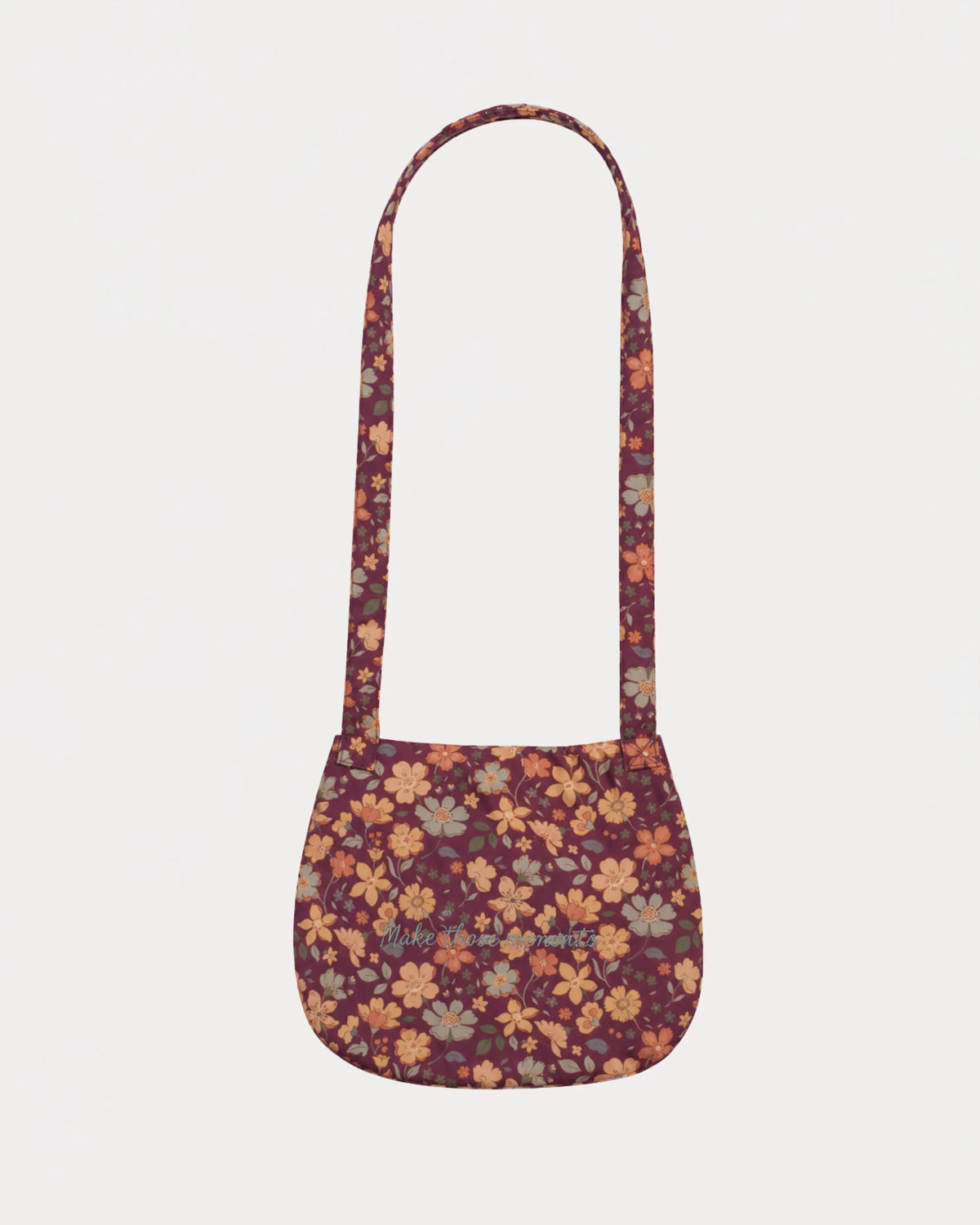 Early Sunday, Hudson Purse in Garden Flowers Plum, made from Printed Cotton Satin fabric, featuring a gathered sling purse design with a flap closure, shown in a back flat-lay view