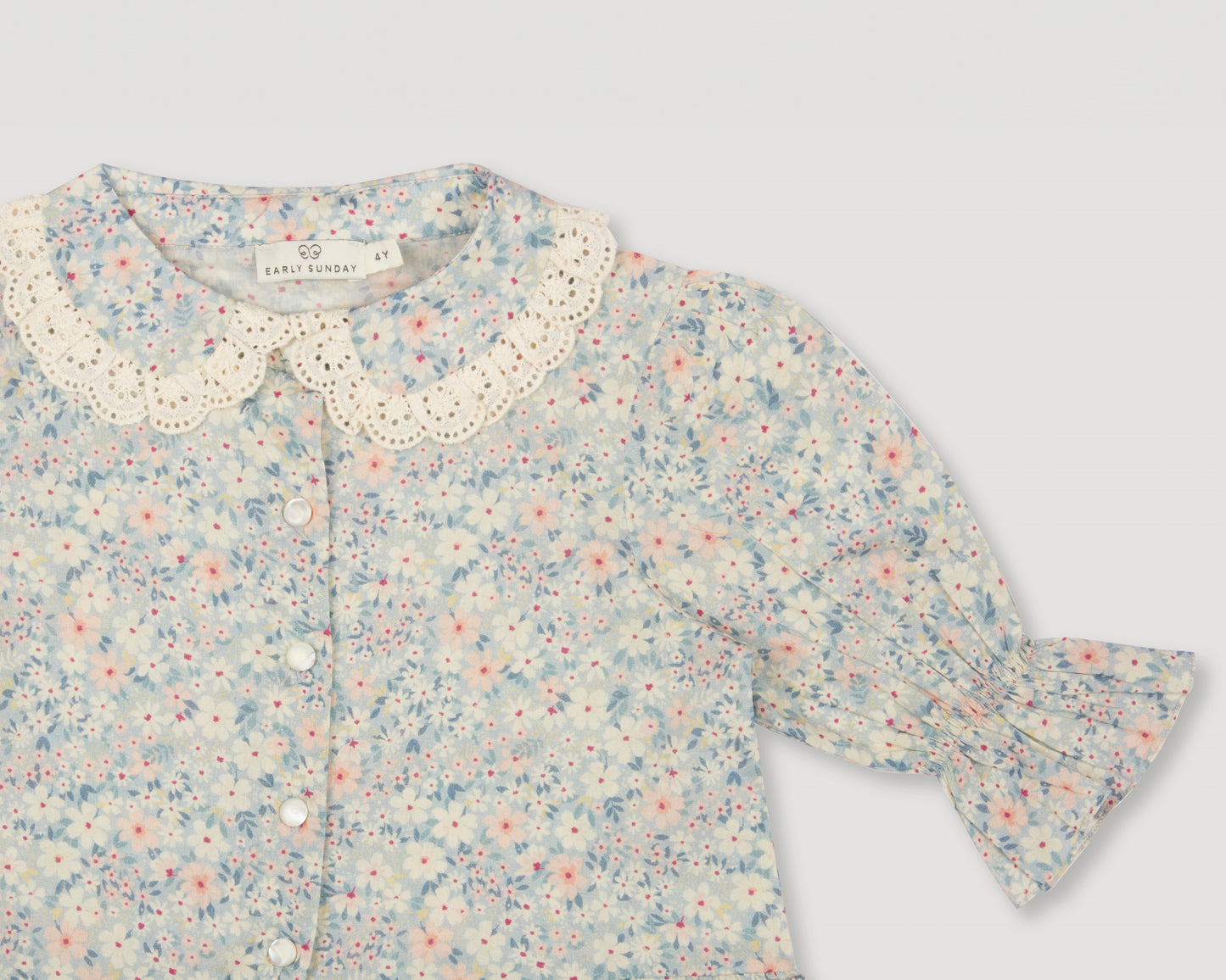 Early Sunday, Iris Blouse in Amelia print, made from Printed Cotton Cambric fabric, featuring relaxed fit with delicate detailing for a timeless and feminine look, shown in a closeup flat-lay view