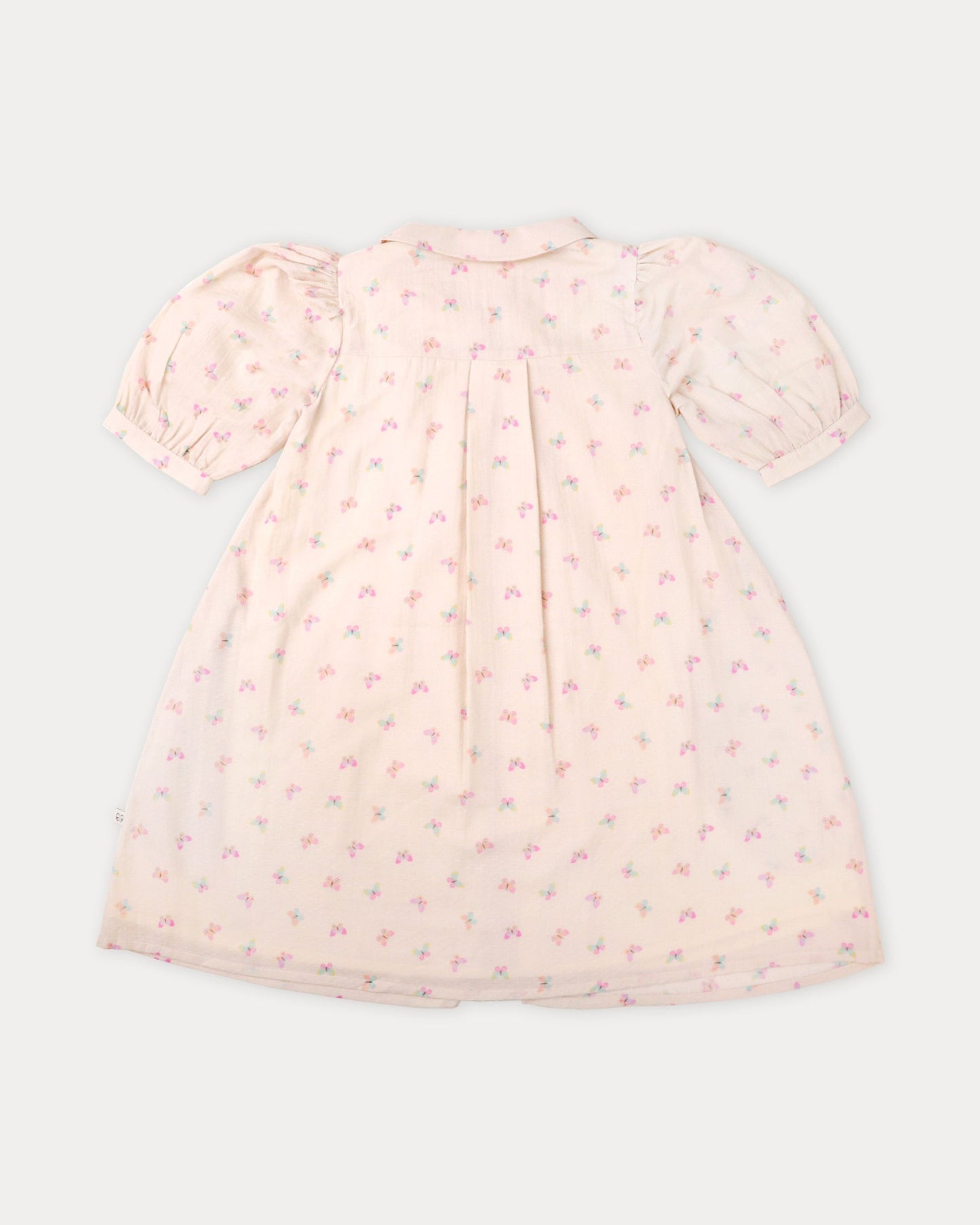 Early Sunday, Jane Dress in Butterfly Print color, made from printed cotton tiny swiss dobby fabric, featuring Smocked / embroidered yoke, peter pan collar and puffed short sleeves, shown in a back flat-lay view
