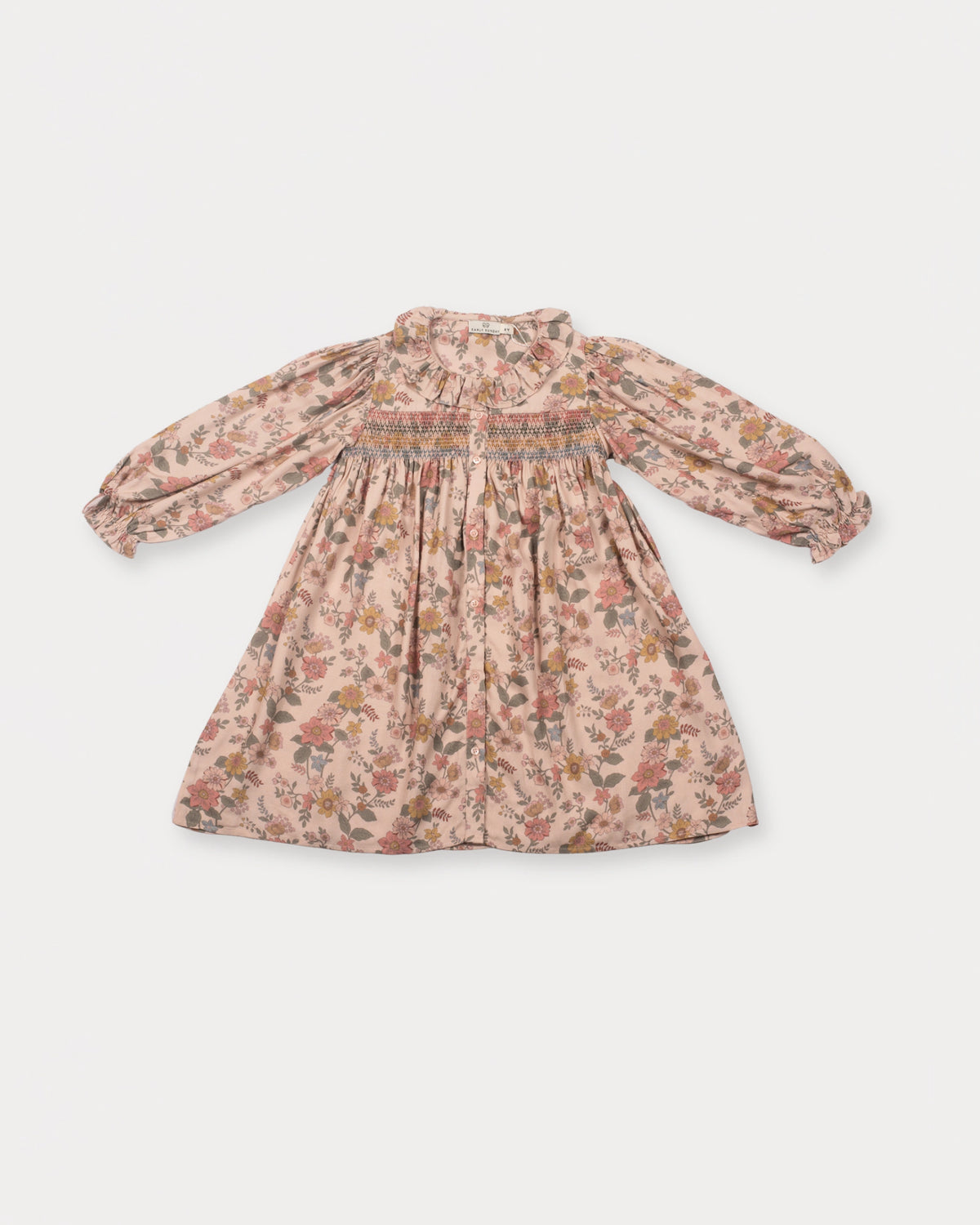 Early Sunday, Jeanette Dress in Bloom, made from Printed Viscose Twill fabric, featuring smocked chest with frilled neckline and soft gathered puff sleeves, shown in a front flat-lay view