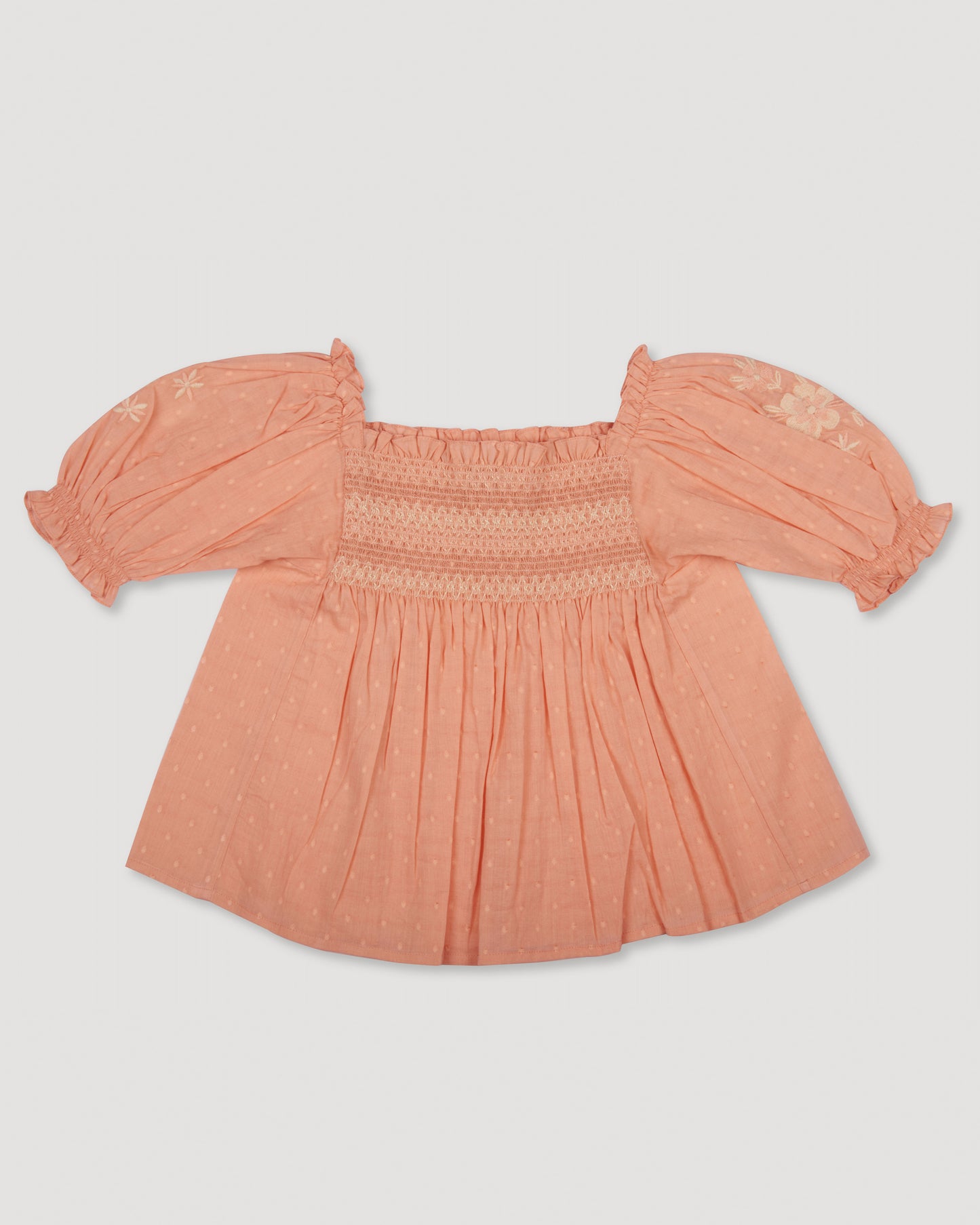 Early Sunday, Judith Blouse in Strawberry color, made from Cotton Dobby Swiss Dots fabric, featuring relaxed fit with delicate finishes, combining style and functionality, shown in a front flat-lay view