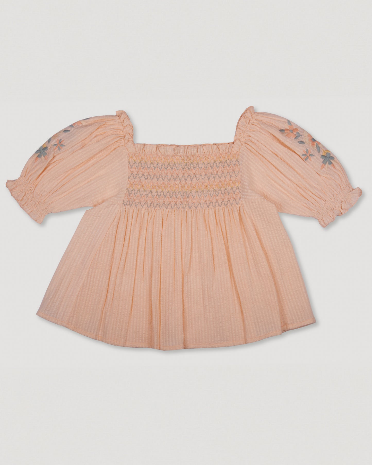 Early Sunday, Judith Blouse in Warm Sand color, made from Cotton Seersucker fabric, featuring relaxed fit with delicate finishes, combining style and functionality, shown in a front flat-lay view
