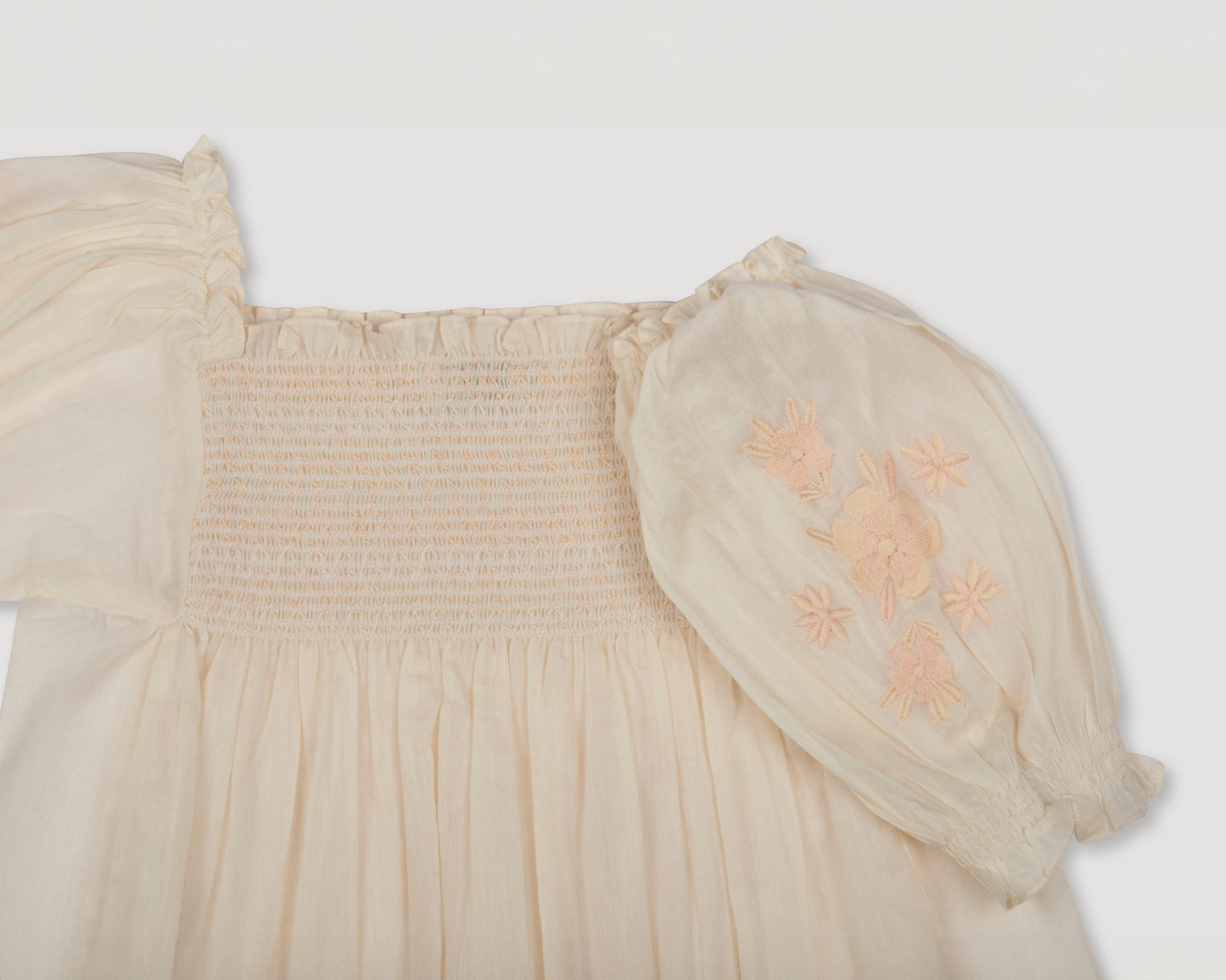 Early Sunday, Judith Blouse in Cream color, made from Cotton Voile fabric, featuring relaxed fit with delicate finishes, combining style and functionality, shown in a closeup flat-lay view